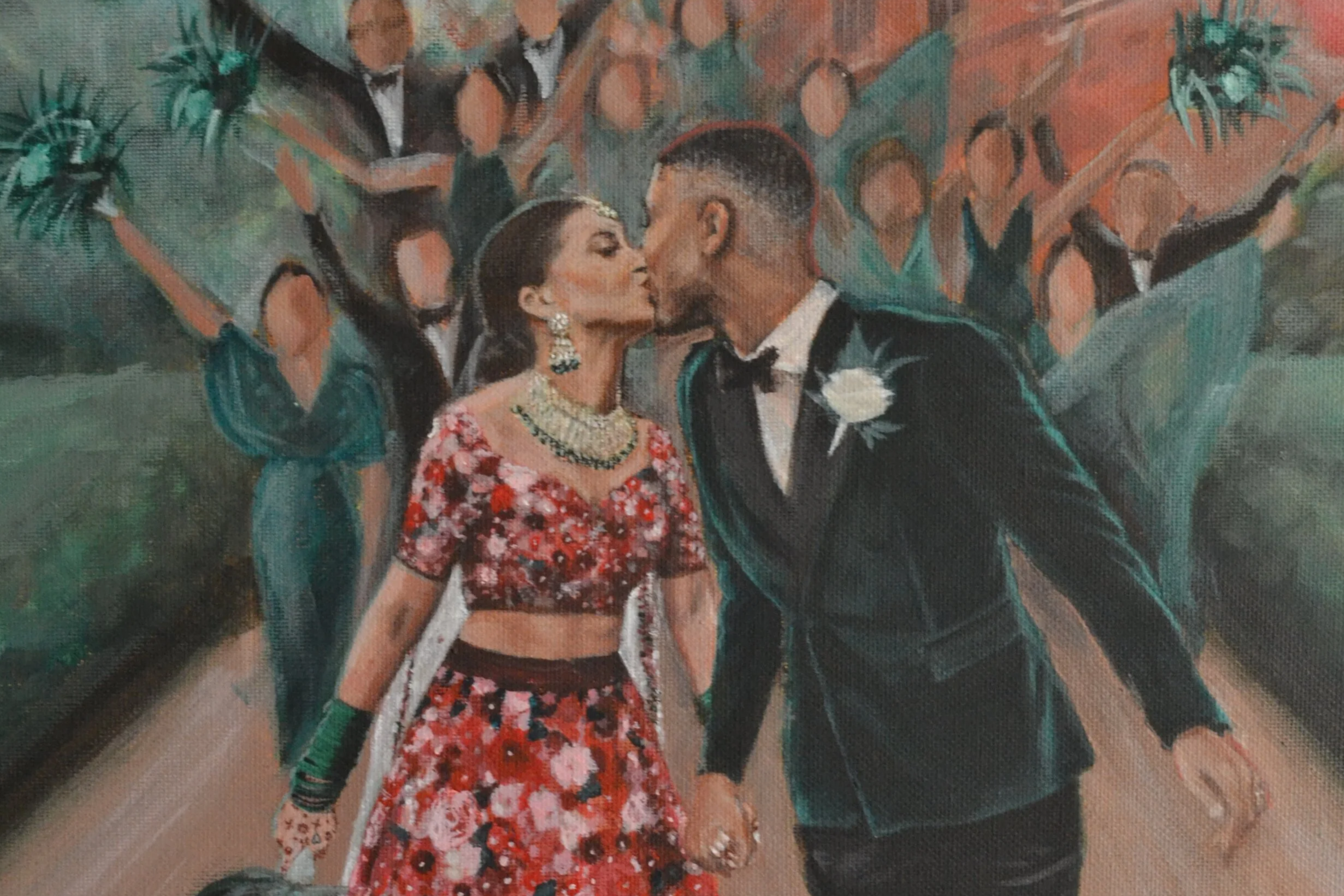 A man and woman in formal wedding attire sharing a kiss at their wedding, with a background of bridesmaids and groomsmen.