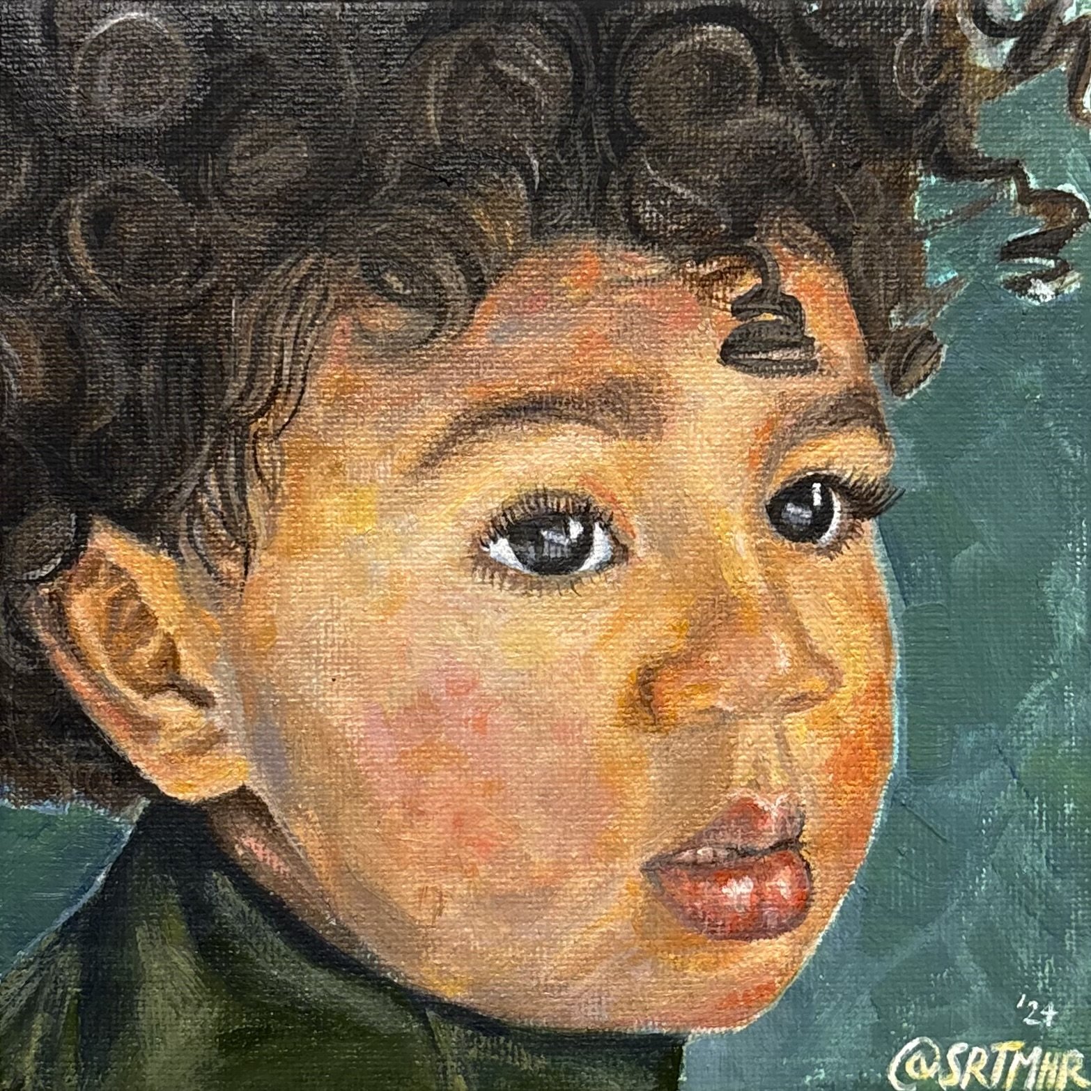 Close-up of a young child with curly hair, expressive eyes, and slightly parted lips, wearing a dark green top. The background is bluish-green.