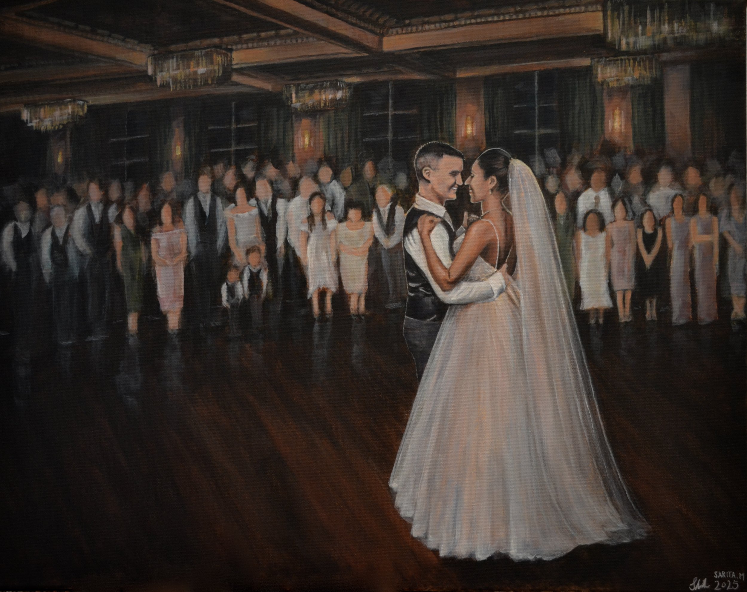 A bride and groom dance together at their wedding reception, surrounded by guests in a ballroom with chandeliers and dark wooden floors.