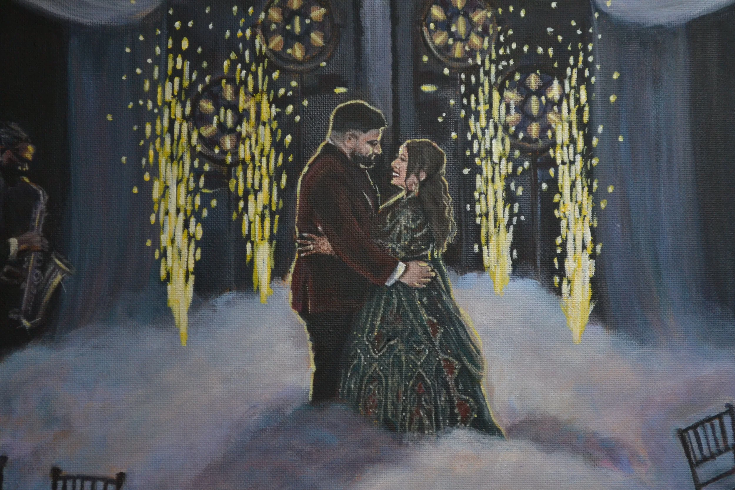 A couple dancing at an elegant event, with a golden, floral backdrop and a saxophone player in the background.