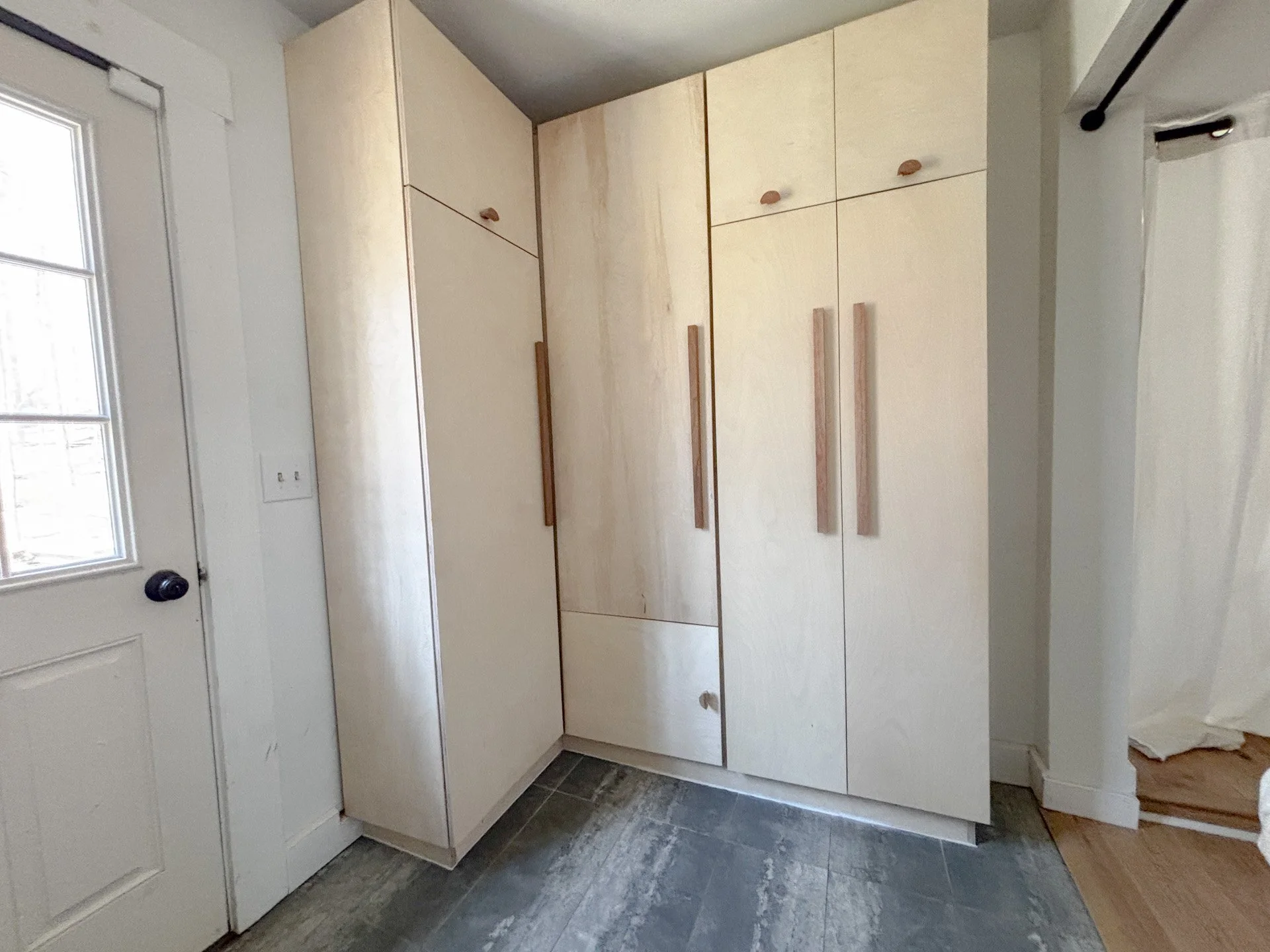 Laundry storage unit High Falls, NY. Baltic birch plywood, cherry and osage orange door handles