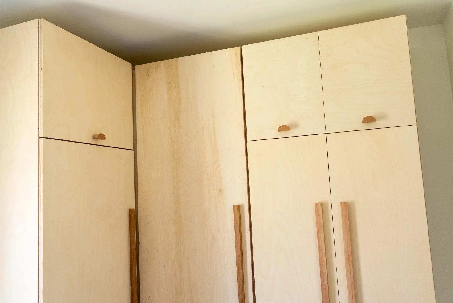 Laundry storage unit High Falls, NY. Baltic birch plywood, cherry and osage orange door handles