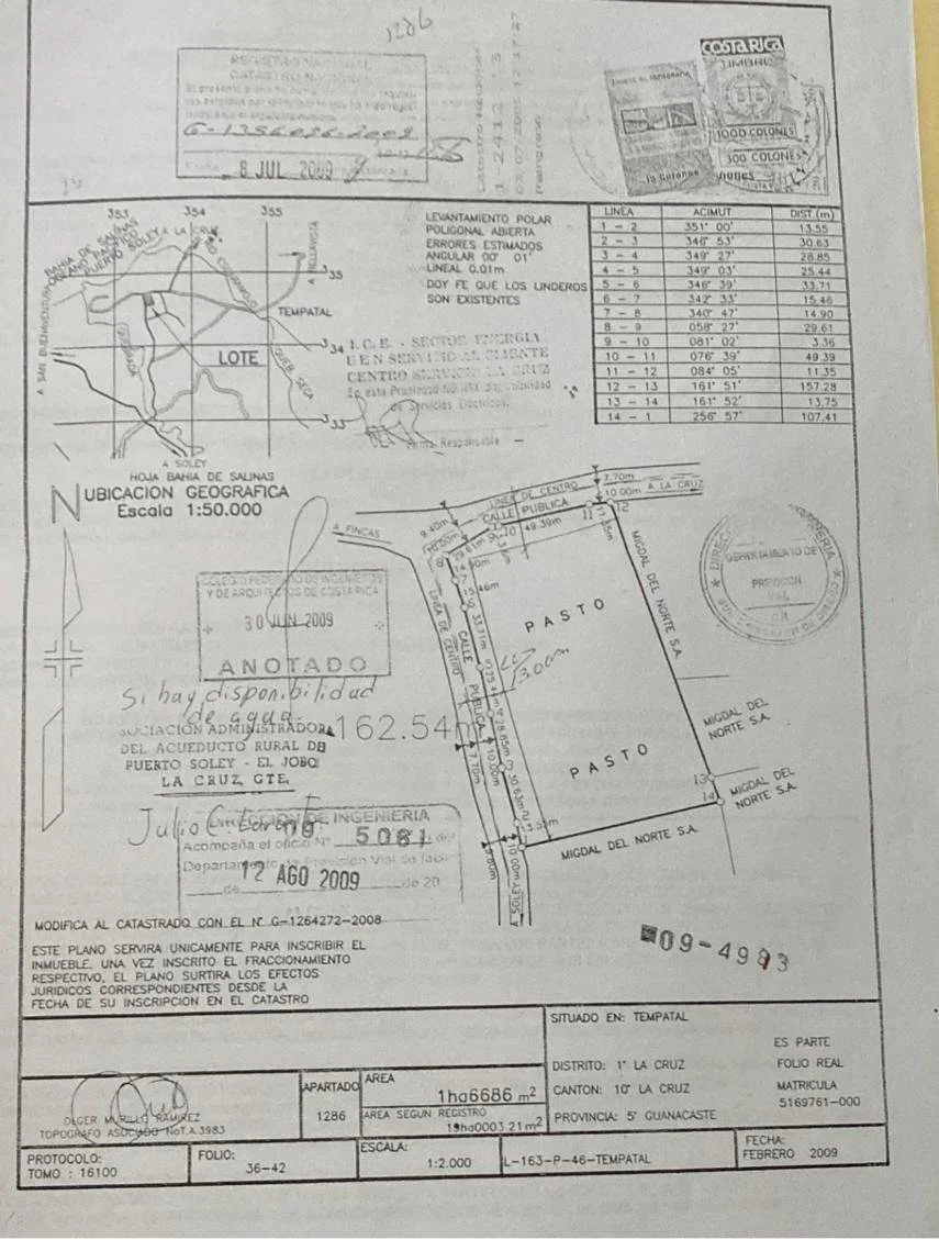 A detailed survey map and technical document showing property boundaries, roads, and geographic features in Puerto Sol y El Jobo, La Cruz, Costa Rica, with stamps, signatures, and handwritten notes.