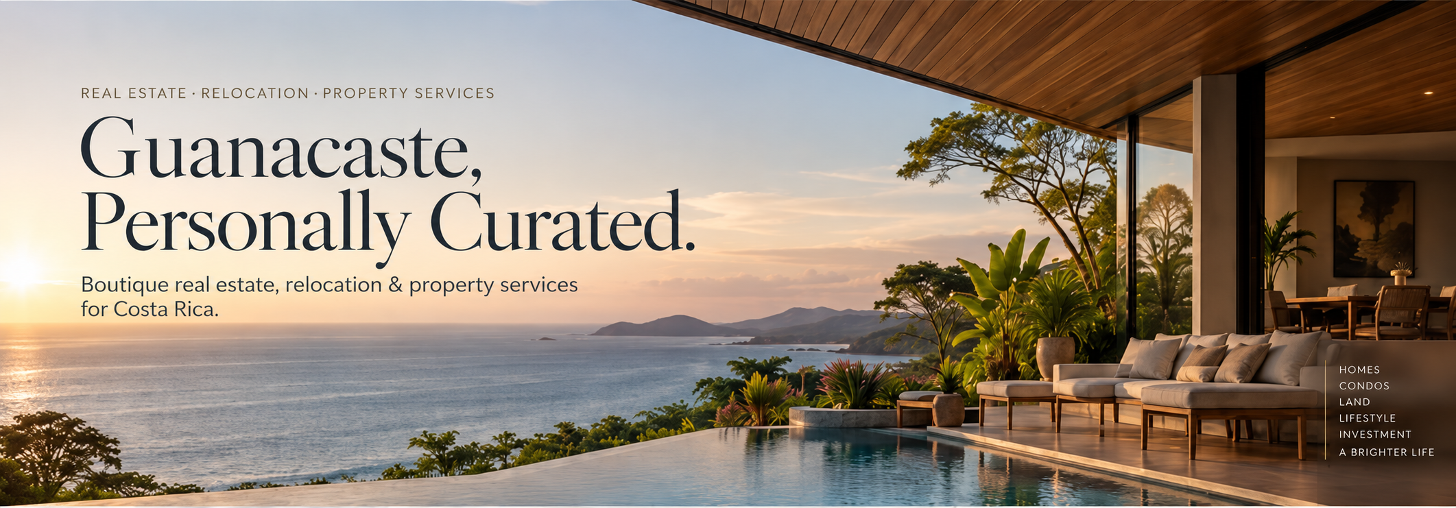 A luxurious outdoor living space overlooking the ocean during sunset with a modern patio, glass walls, lush green plants, and a sitting area with cushions.