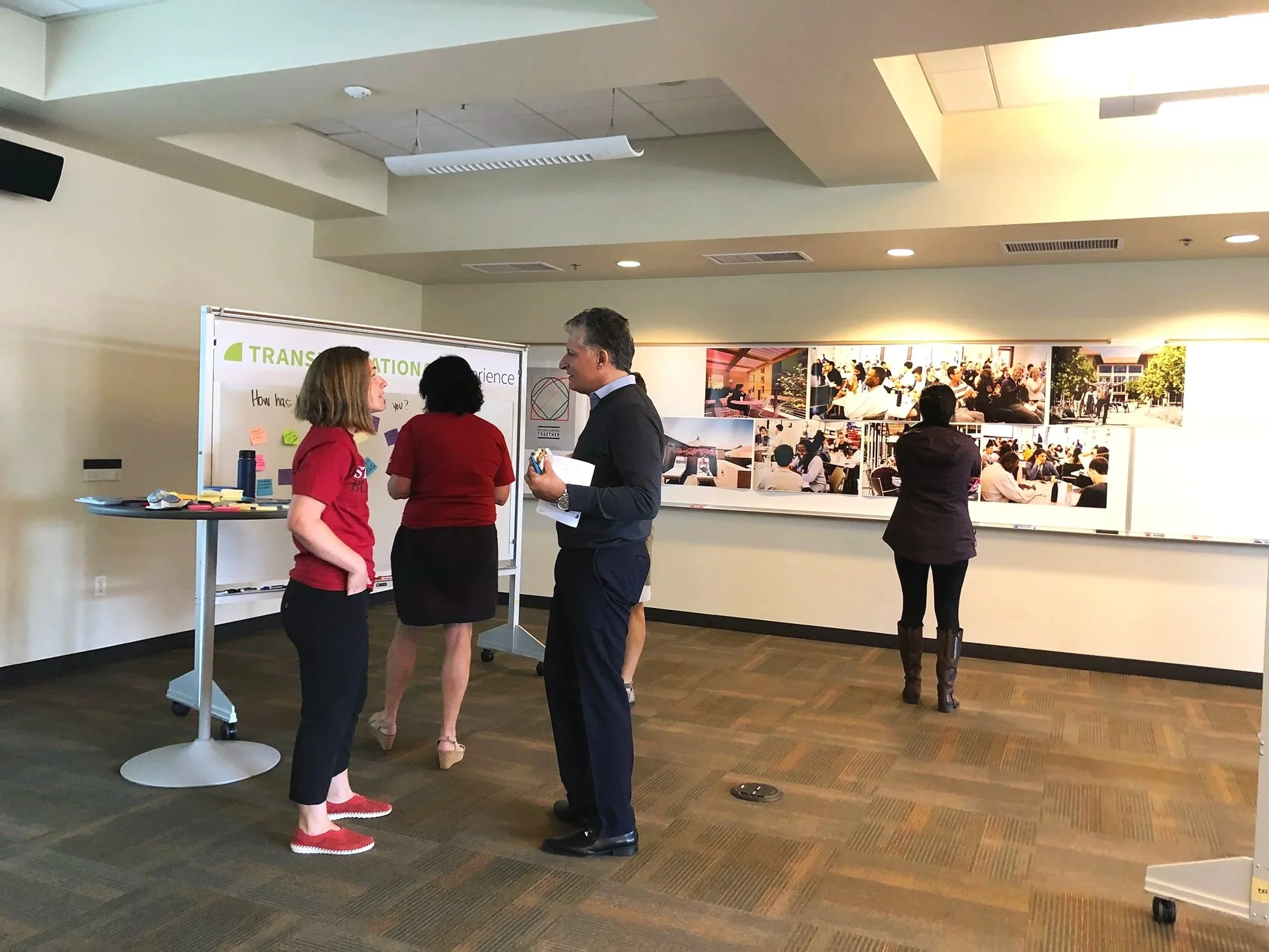 Showcasing GSB Story pillars using shapes and imagery during town hall meeting filled with faculty and staff for 'The Stanford GSB Story,' rolling out the Stanford GSB Brand Refresh