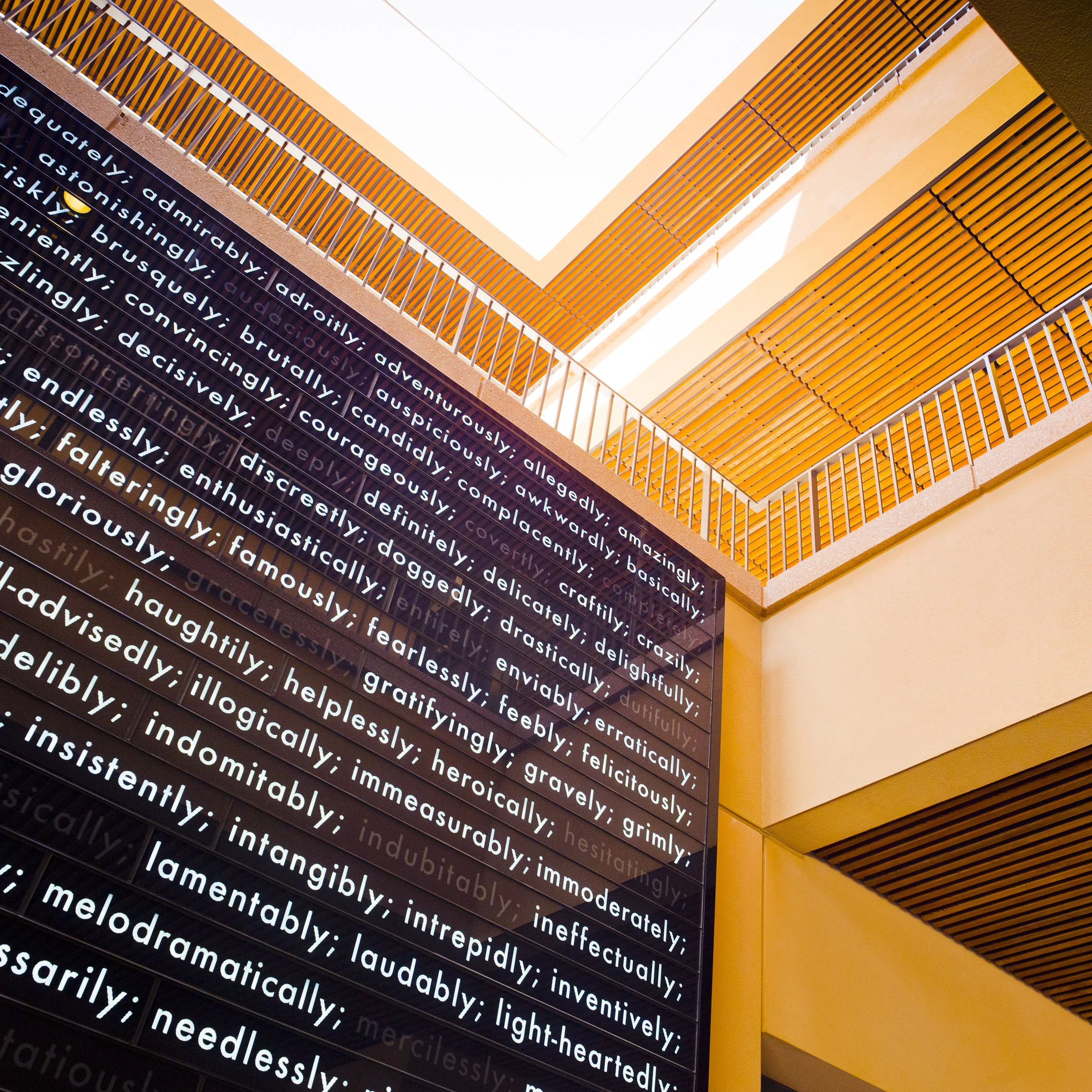 One of two "Change Walls" located at Knight Management Center. "Ways to Change (The Adverb Wall)" kinetic art installation by artist Peter Wegner an LED and glass digital wall installation.