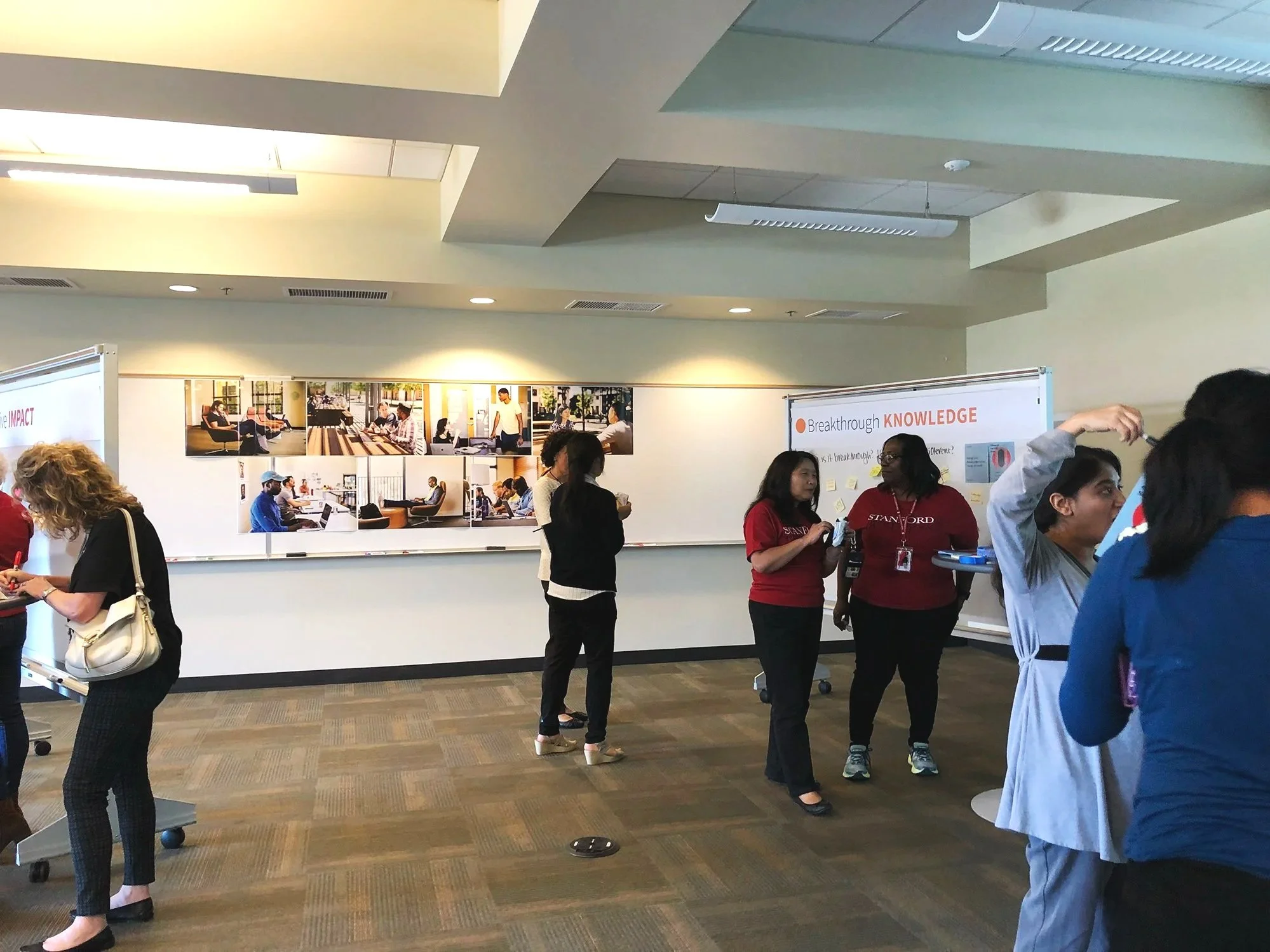 Showcasing GSB Story pillars using shapes and imagery during town hall meeting filled with faculty and staff for 'The Stanford GSB Story,' rolling out the Stanford GSB Brand Refresh