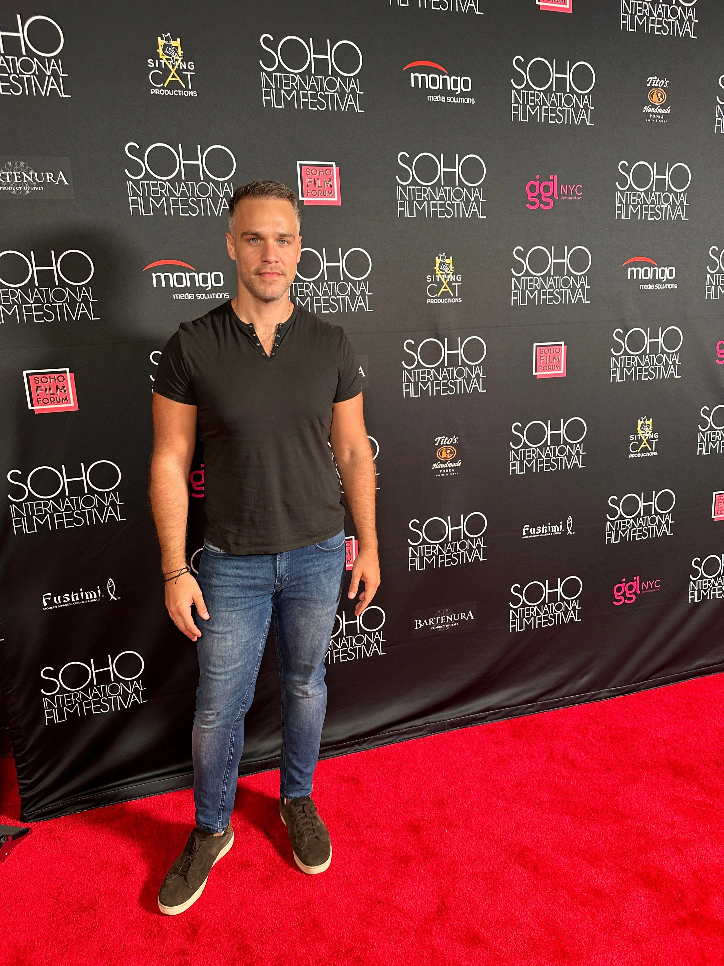 American-Greek-EU actor Taso Mikroulis Sag/aea actor in a suit on the red carpet of Soho international Film festival hazel eyes, grey mixed brunette 40s male