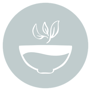 A minimalist logo featuring a leaf inside a bowl on a gray circular background.