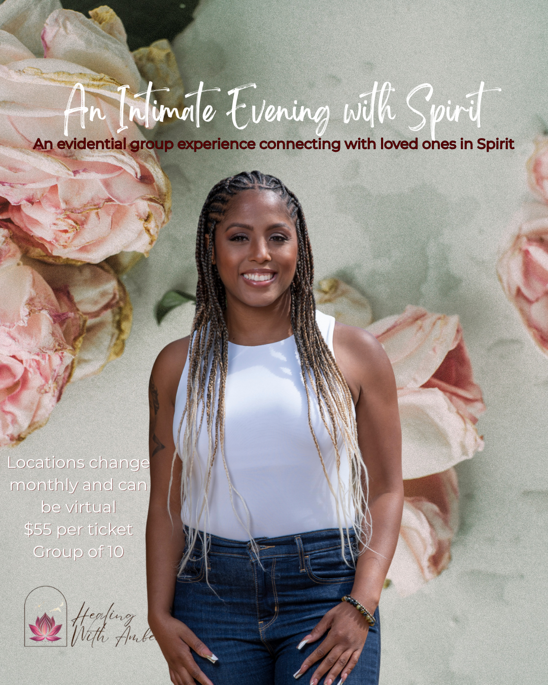 A BIPOC/Black woman with braids wearing a white tank top and blue jeans standing in front of a floral background, smiling.