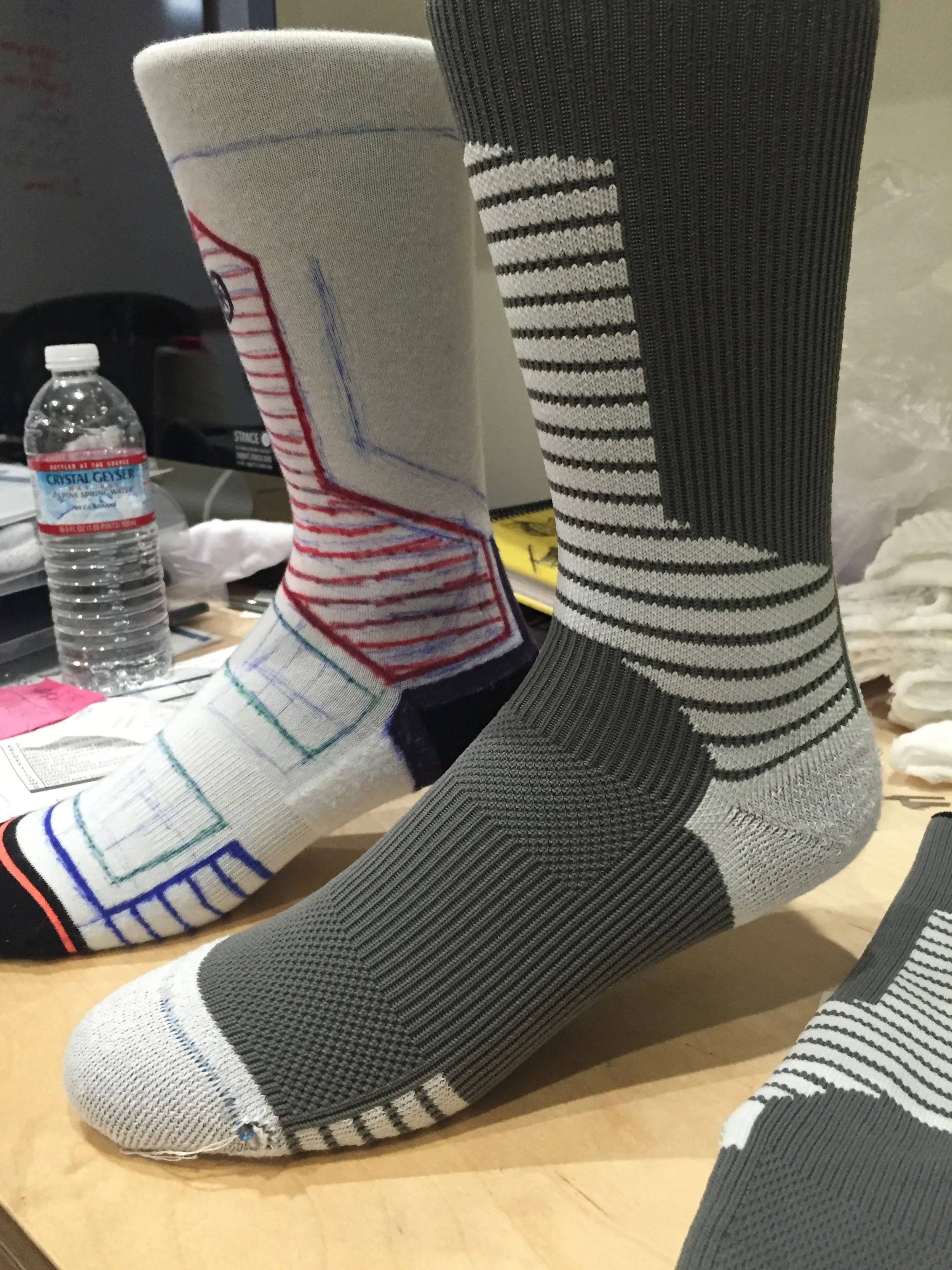 Sketching on blank socks is a nice way to get Ideas down fast. Making a BitMap based on the sketch to produce the prototype is easy once you have a concept.