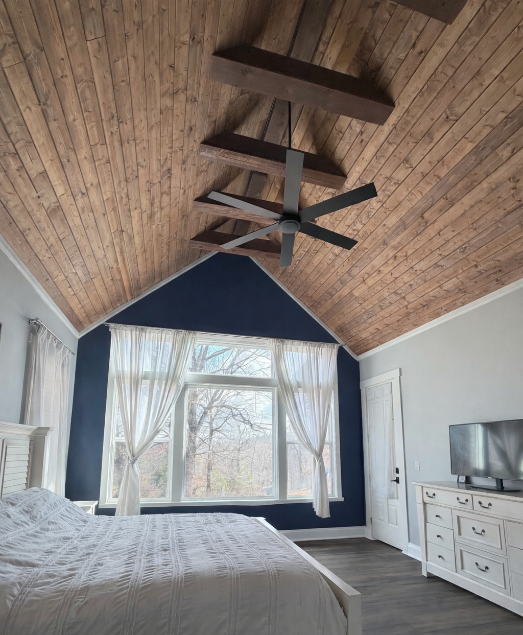 vaulted ceiling tongue and groove oversized windows beams