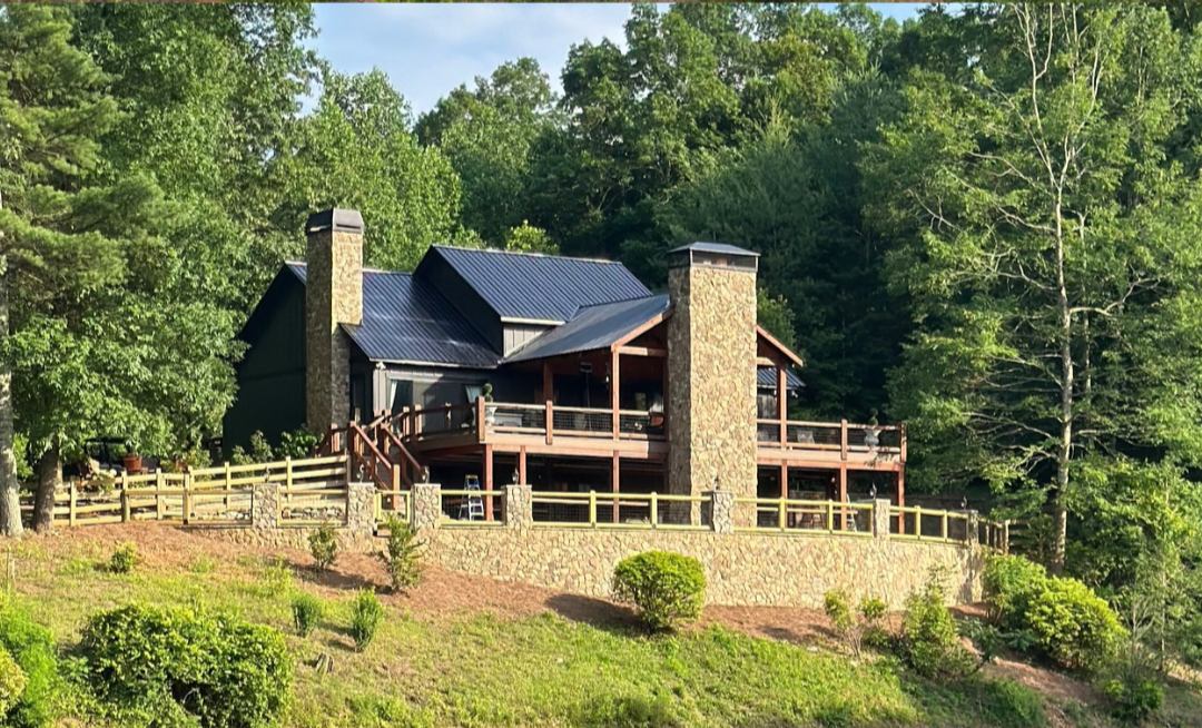 after - outdoor expansion/renovation, patio deck system, outdoor lighting, multi level fireplace addition, grading and yard expansion with retaining wall, rock work, outdoor living, exterior home painting and gutter system install.