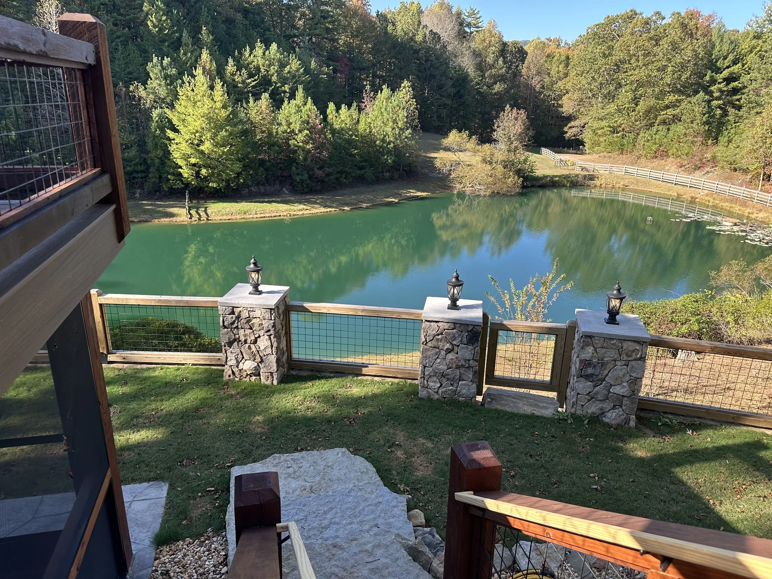 hardscape, retaining wall, patio lighting, trex decking, stone columns