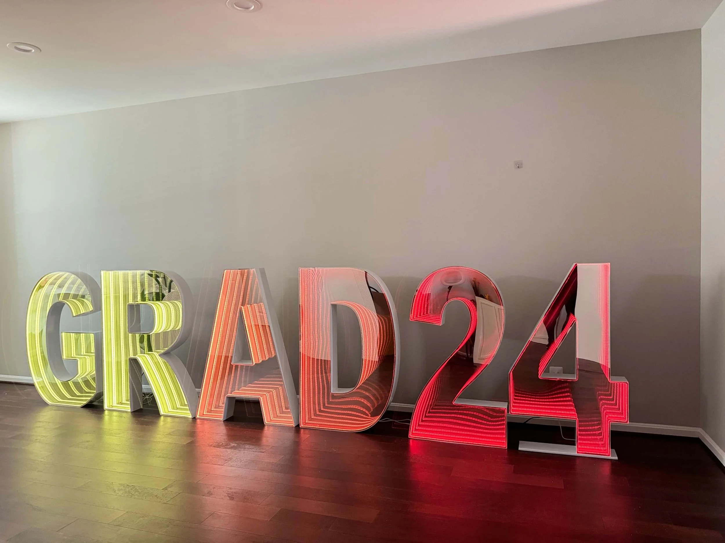 GRAD24 LED marquee letters illuminated for graduation celebration.