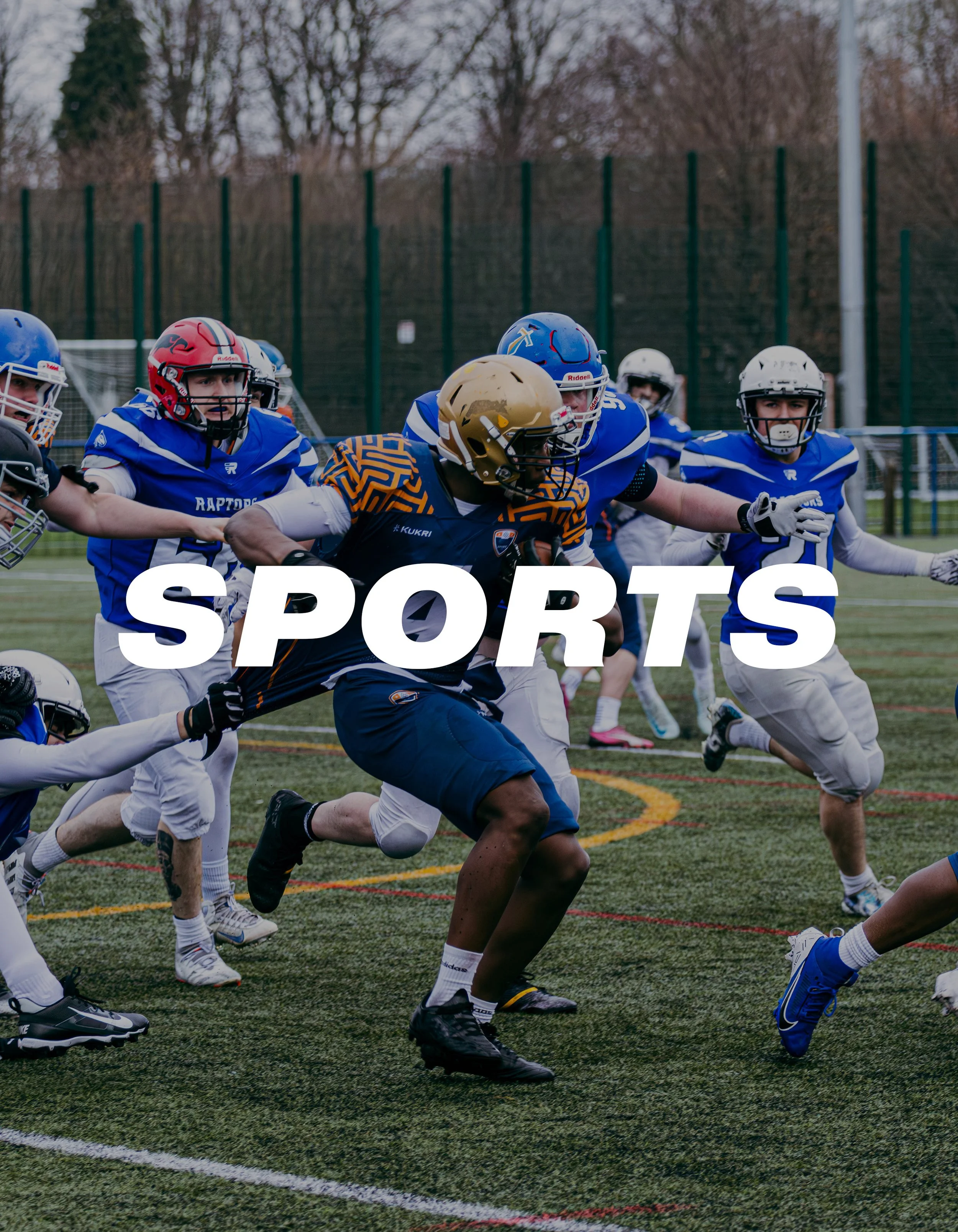Young football players in blue and white uniforms on a field during a game, with the word 'SPORTS' overlaid in white text.
