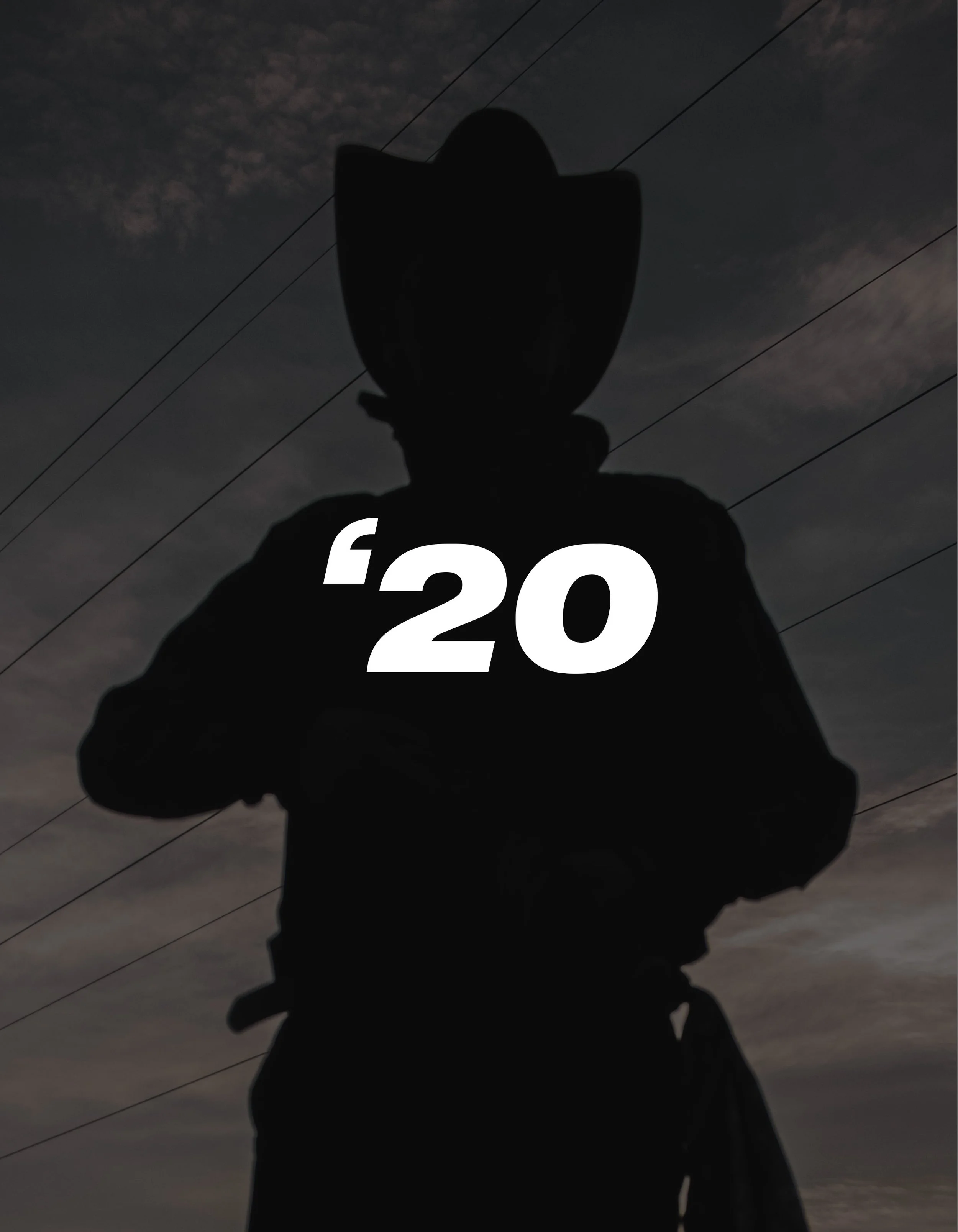 Silhouette of a person wearing a helmet with '20' written on their chest against a cloudy sky.