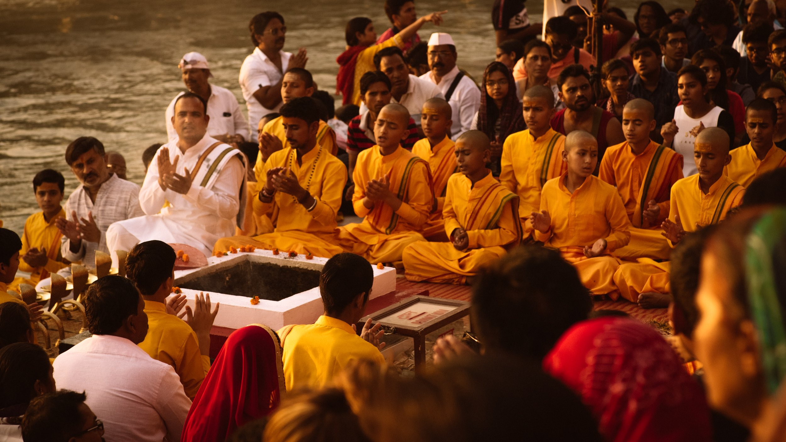 Group of Indian people participating in a cerimony.