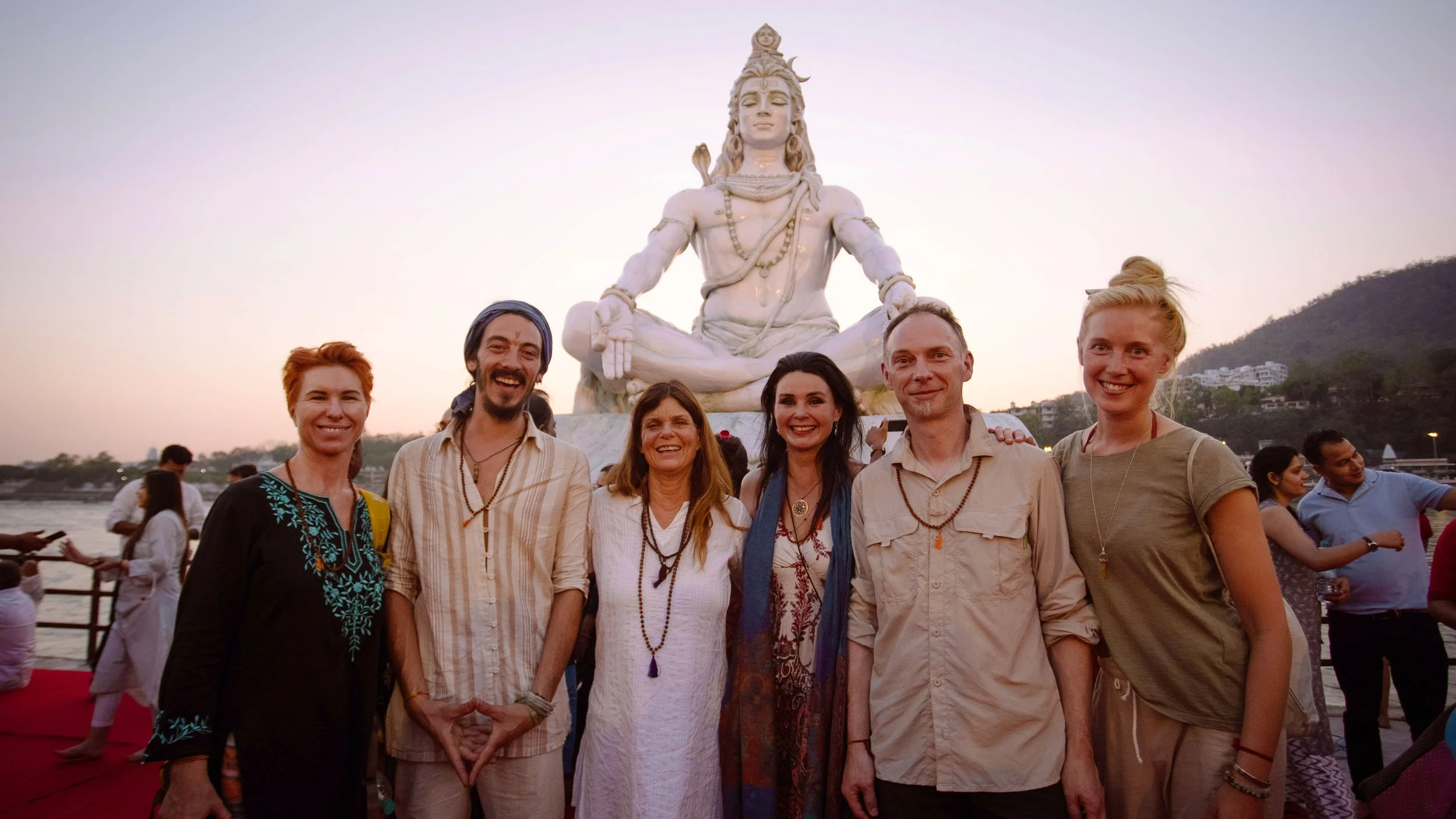 Group of people smiling during a journey with India Sacred Journey.