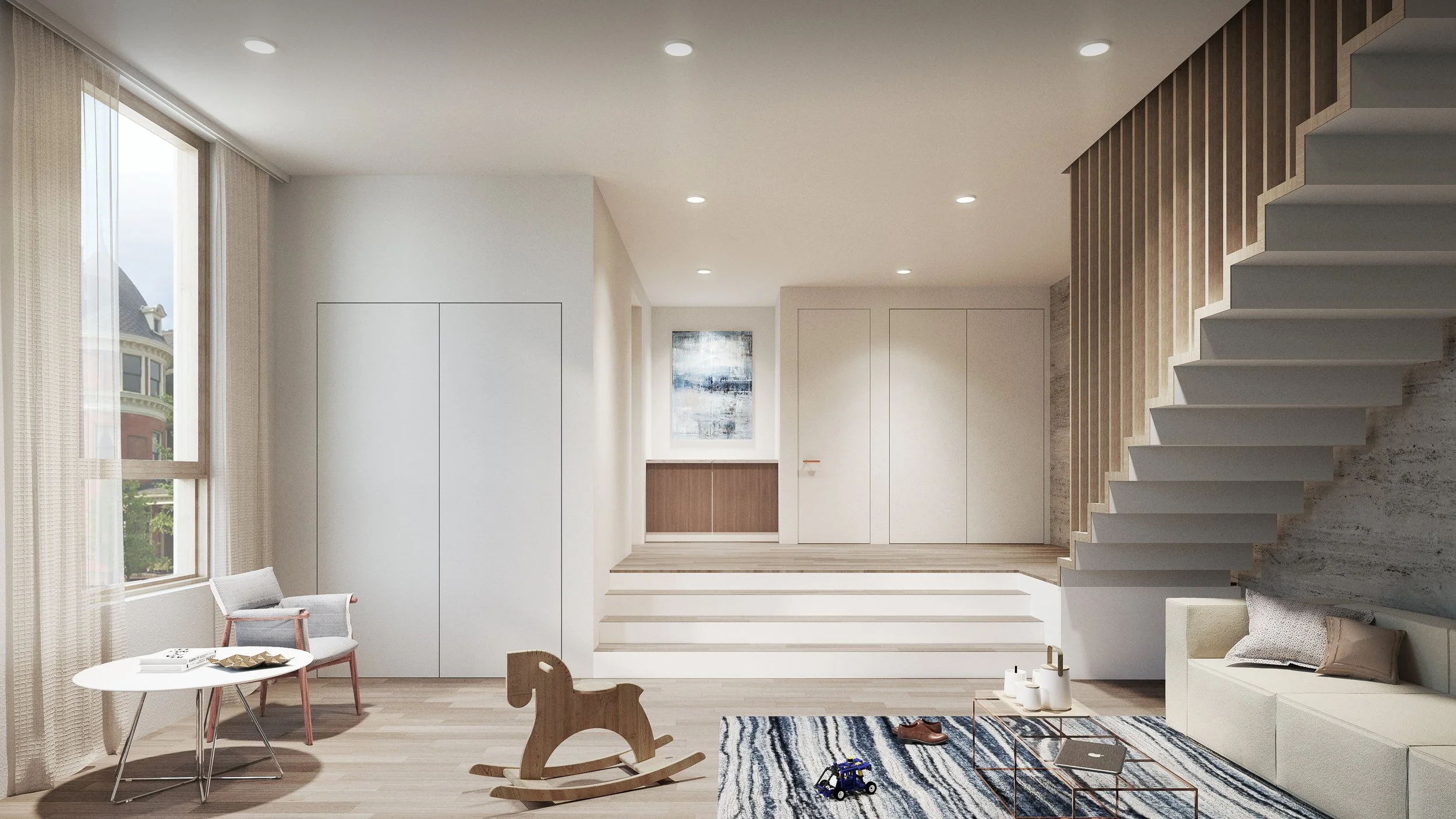 Modern living room with white walls, large window with beige curtains, light wood flooring, and minimalist furniture. There is a white sofa with pillows, a patterned rug, a small table, children's toys, and a wooden rocking horse. The staircase has white steps and wooden railings.