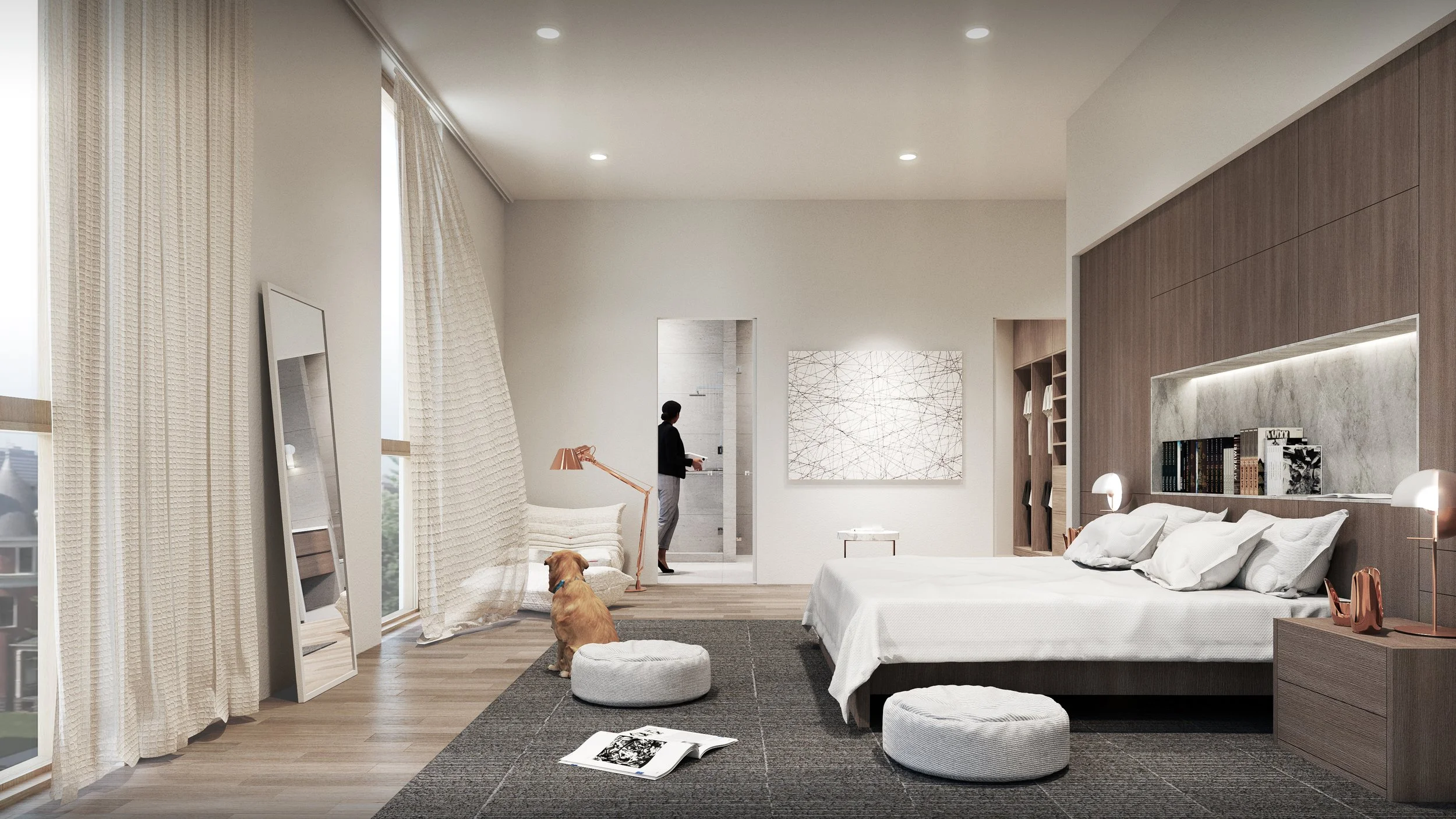 Modern bedroom with large windows and cream curtains, white bed with pillows, wooden nightstand with lamps, a person entering the bathroom, a dog sitting on a round cushion, artwork on the wall, and a reading area with bookshelf.