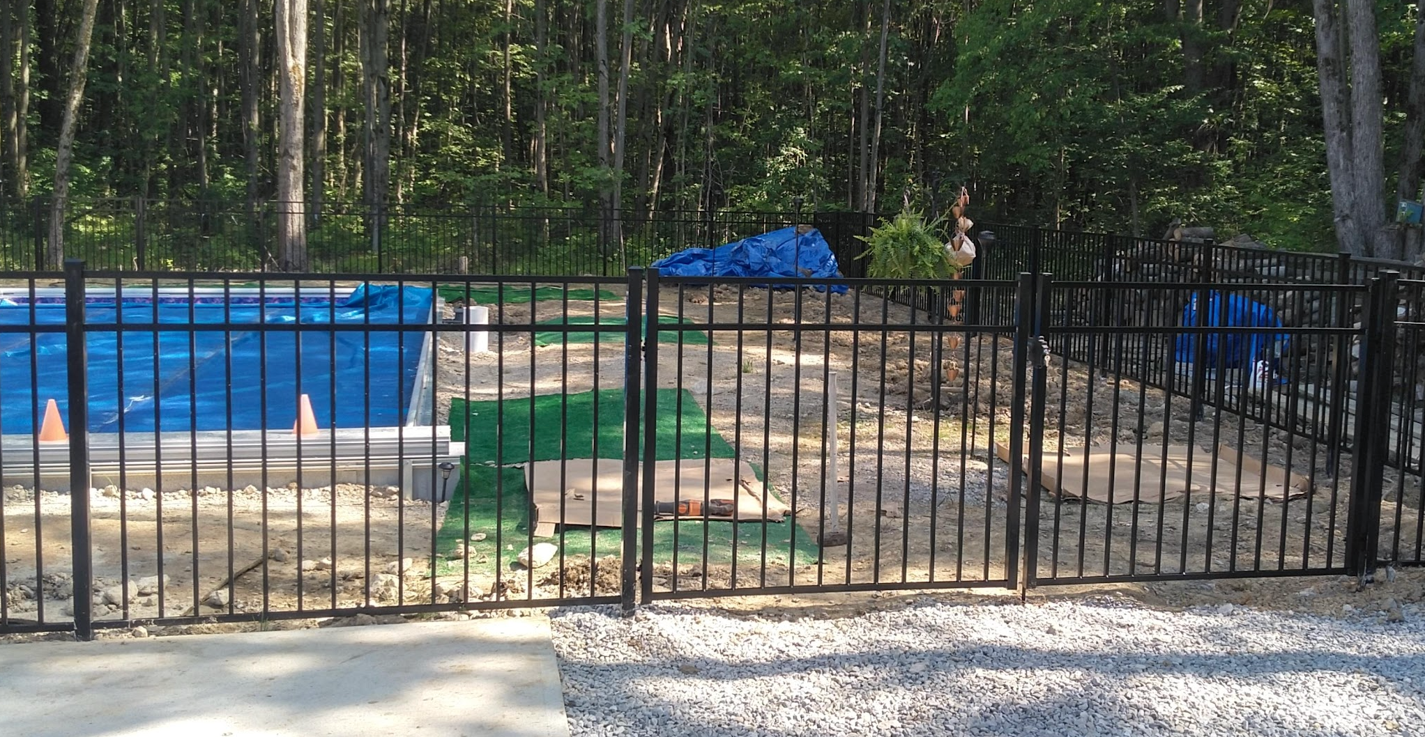 Ornamental fence and gate around a pool
