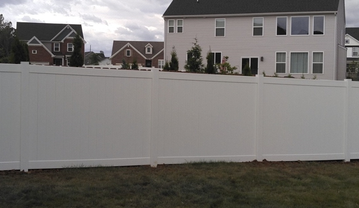 white vinyl fence installed by All Outdoor Fence & More