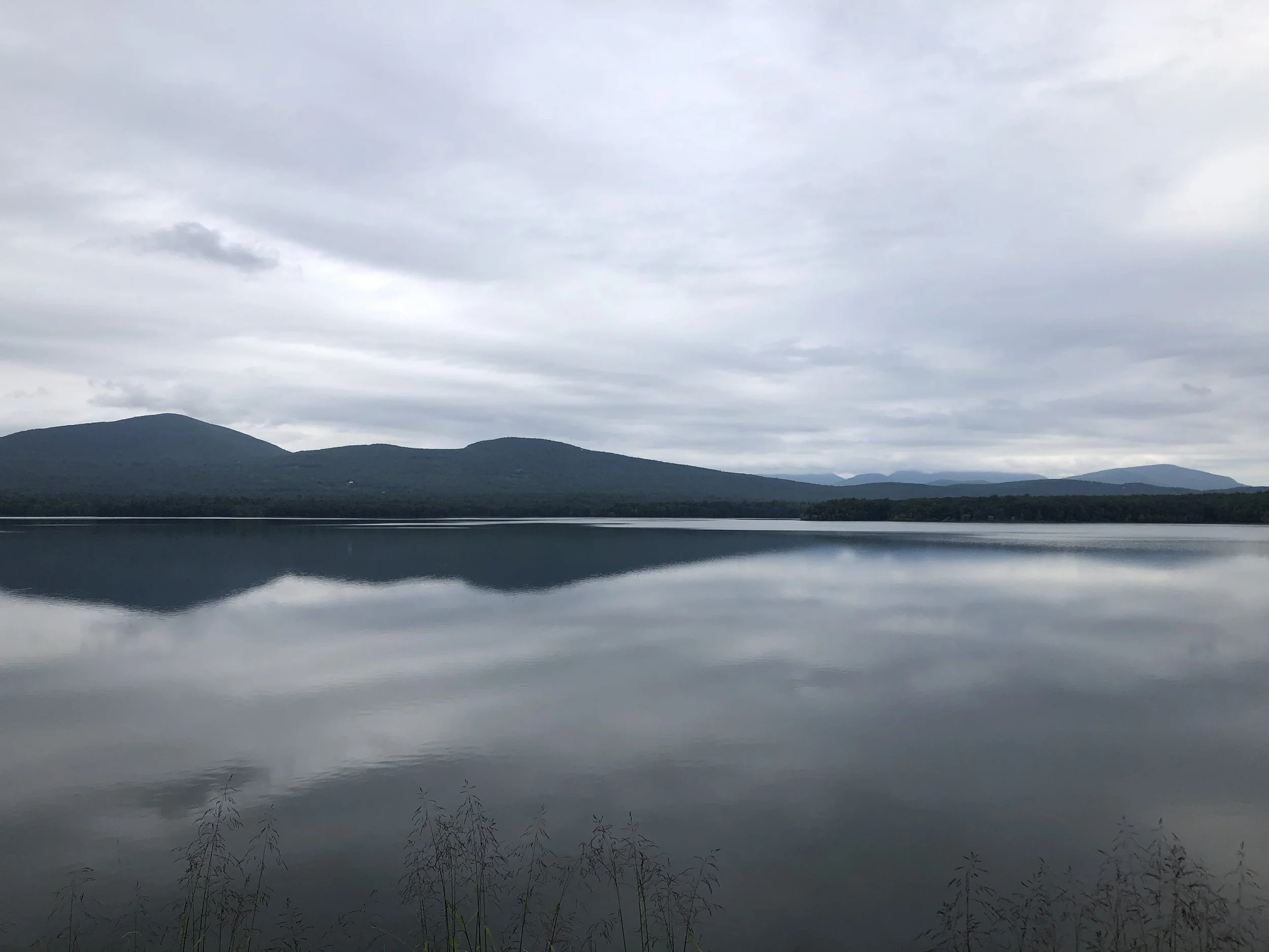 Serene scene of clean lake and mountains