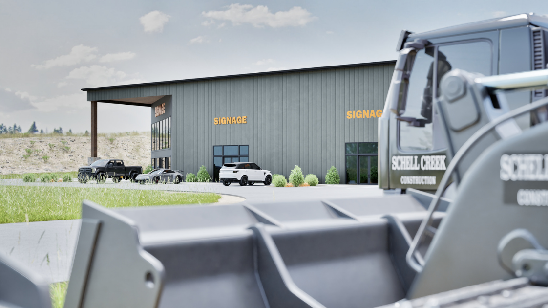 A modern commercial building with large glass windows and orange signage on a clear day. In front of the building, there are several parked cars and landscaping with bushes and grass. A construction machine with the label "Schell Creek Construction" 