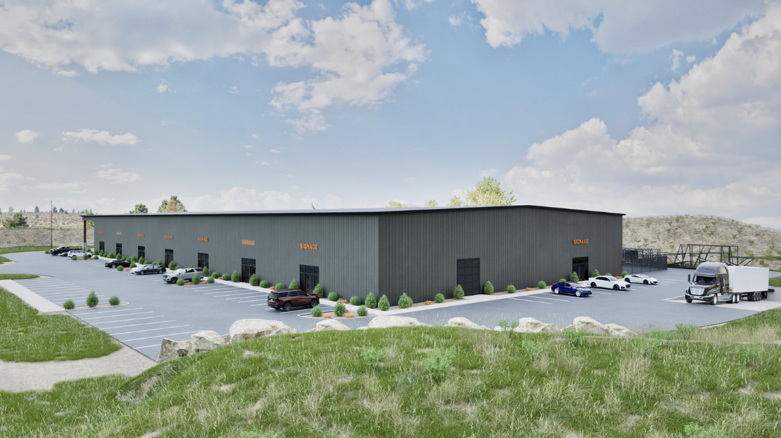 Rendering of a large industrial warehouse building with parking lot and surrounding greenery.
