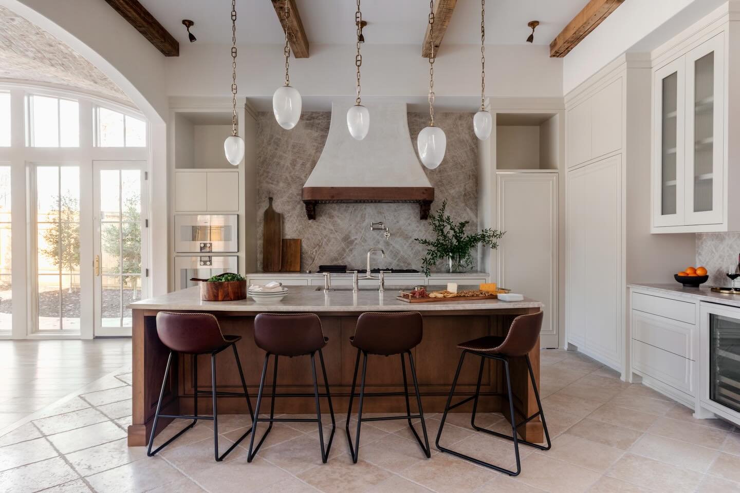 Every detail was designed with intention&mdash;from custom-fitted cabinetry and integrated push-open doors and drawers to Gaggenau appliances, hand-selected stone, mixed flooring, and exposed wood beams. A kitchen where nothing is standard and everyt
