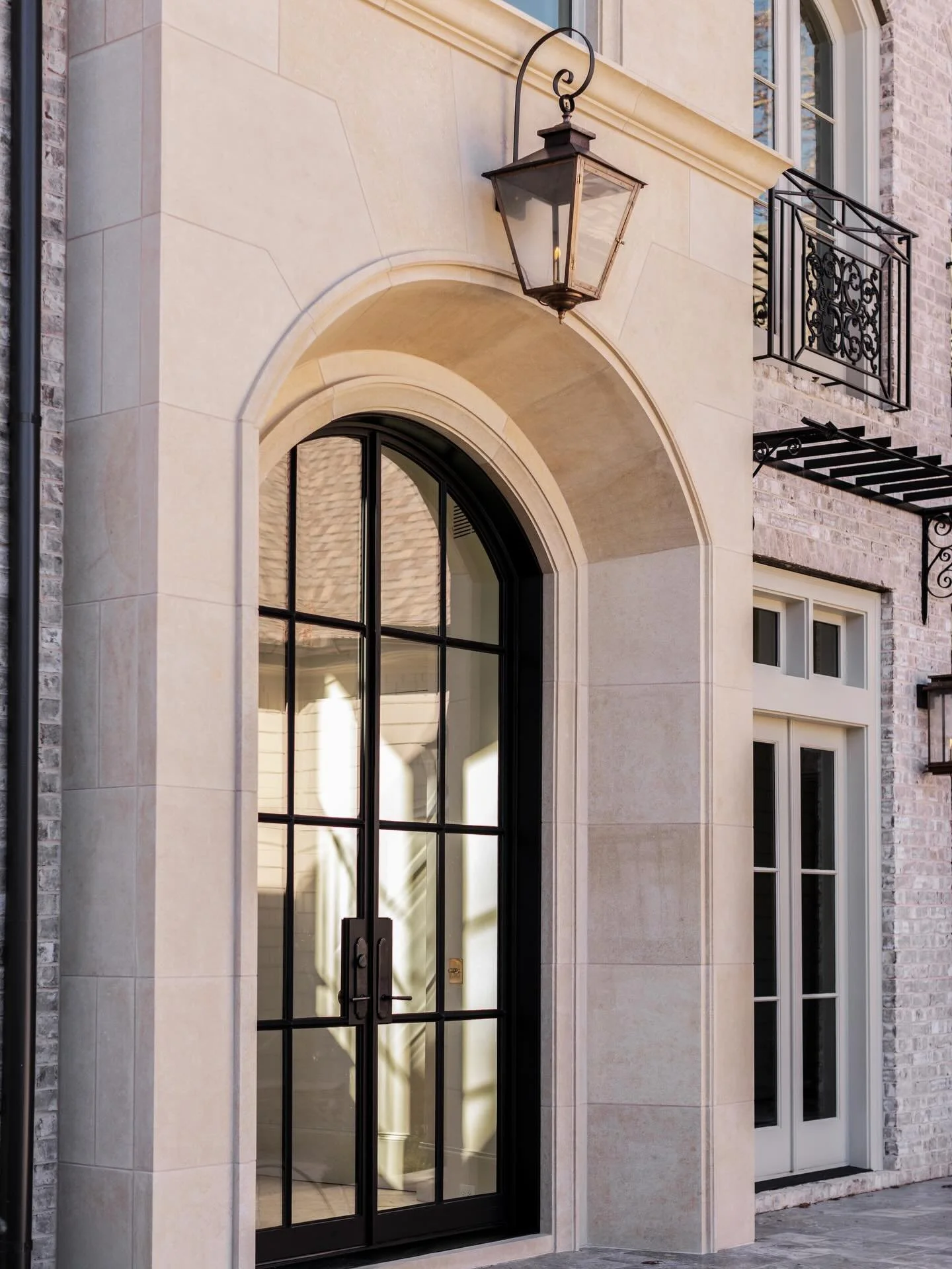 Timeless from the first glance. ✨
Hand-set cast stone, the warm glow of a gas lantern, and a custom iron door&mdash;every detail chosen with intention, crafted to last.

This is what custom homes by Lehigh are made of.

Builder @lehigh_homes
Architec