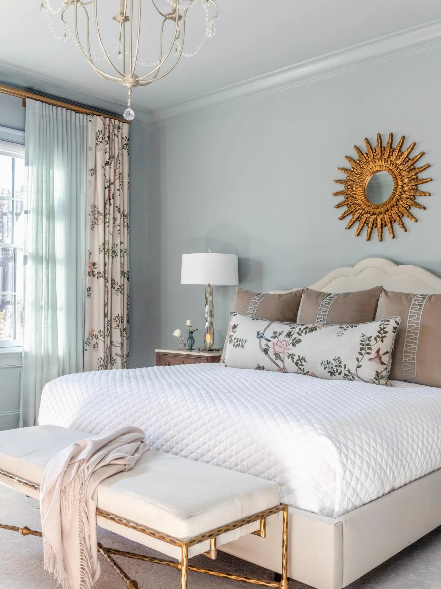 A space designed to exhale. 

In this primary suite, color-drenched walls wrap the room in a soft, calming palette while natural light pours in through windows overlooking the pool&mdash;blurring the line between indoors and out. Every detail was tho