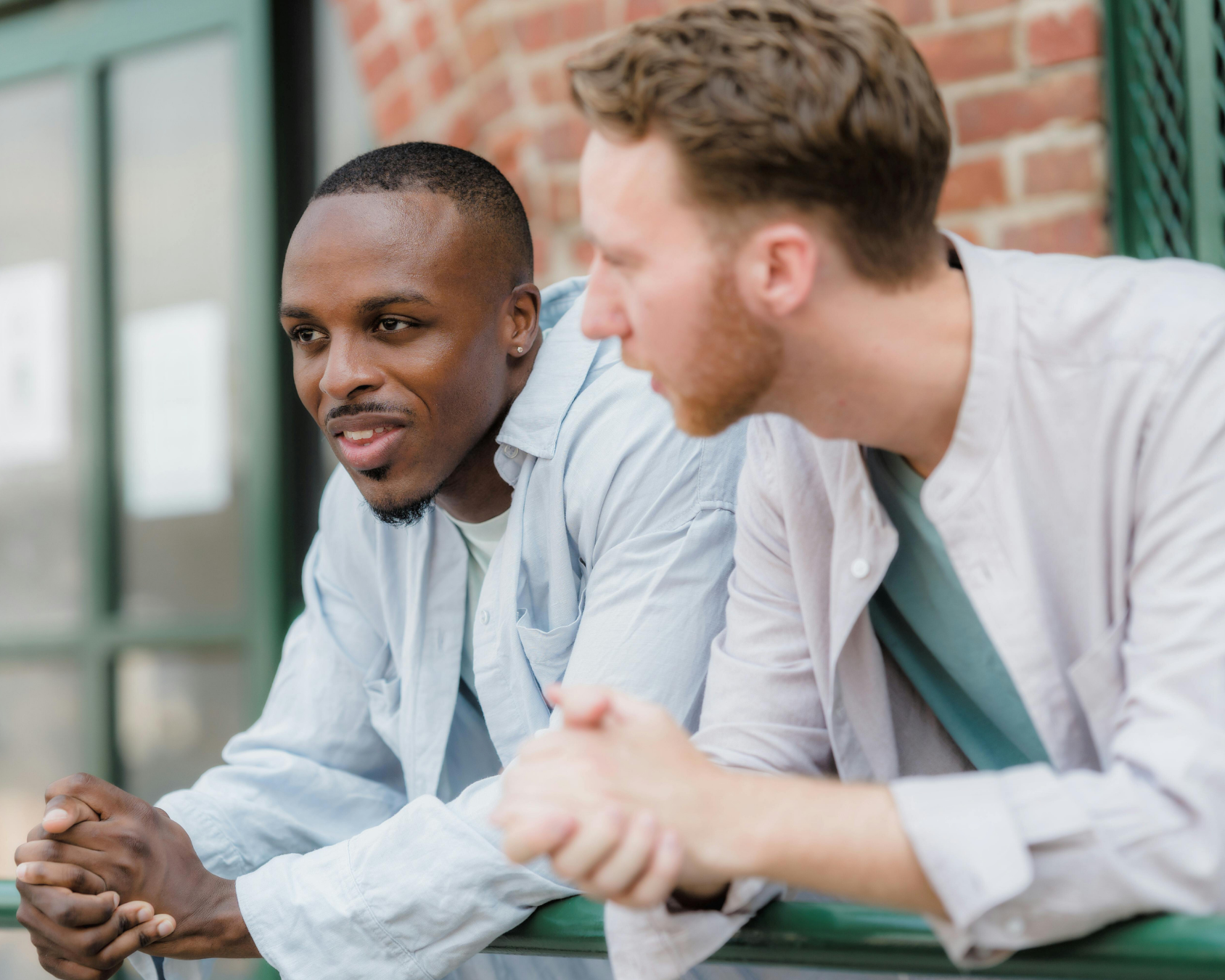 Two men in conversation, representing consultation and discussion about penile girth enhancement options