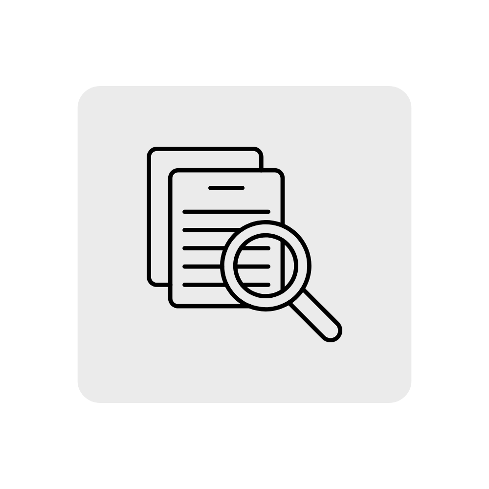 Documents with a magnifying glass examining them