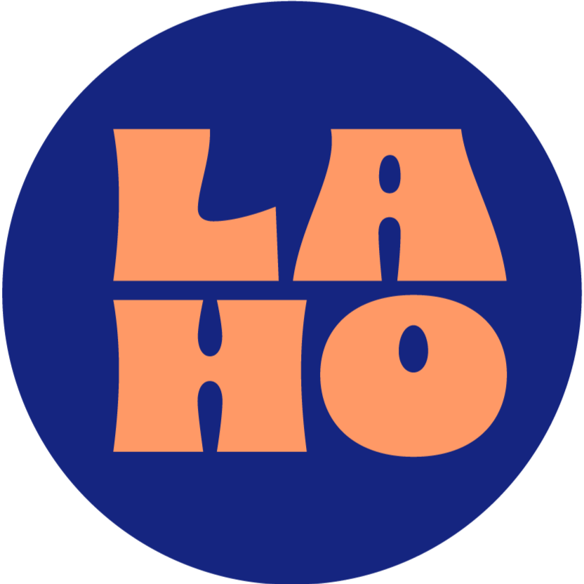 round icon with deep lazuli blue circle under papaya-colored text saying "LAHO," the stylized nickname for Lazuli House.