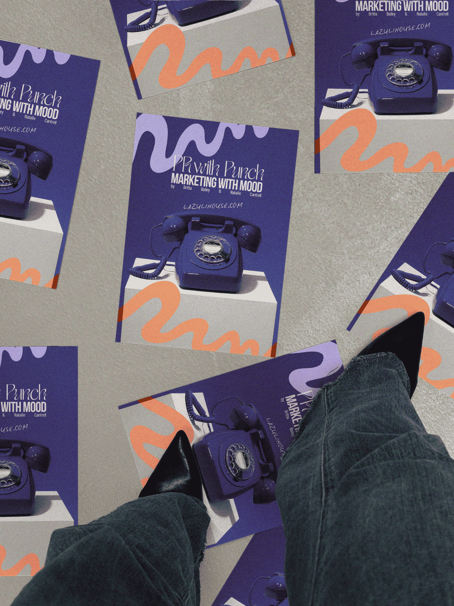 posters of lazuli house saying, "pr with punch, marketing with mood" strewn across a floor while being stepped on by pointed black heels covered by wide-leg jeans.