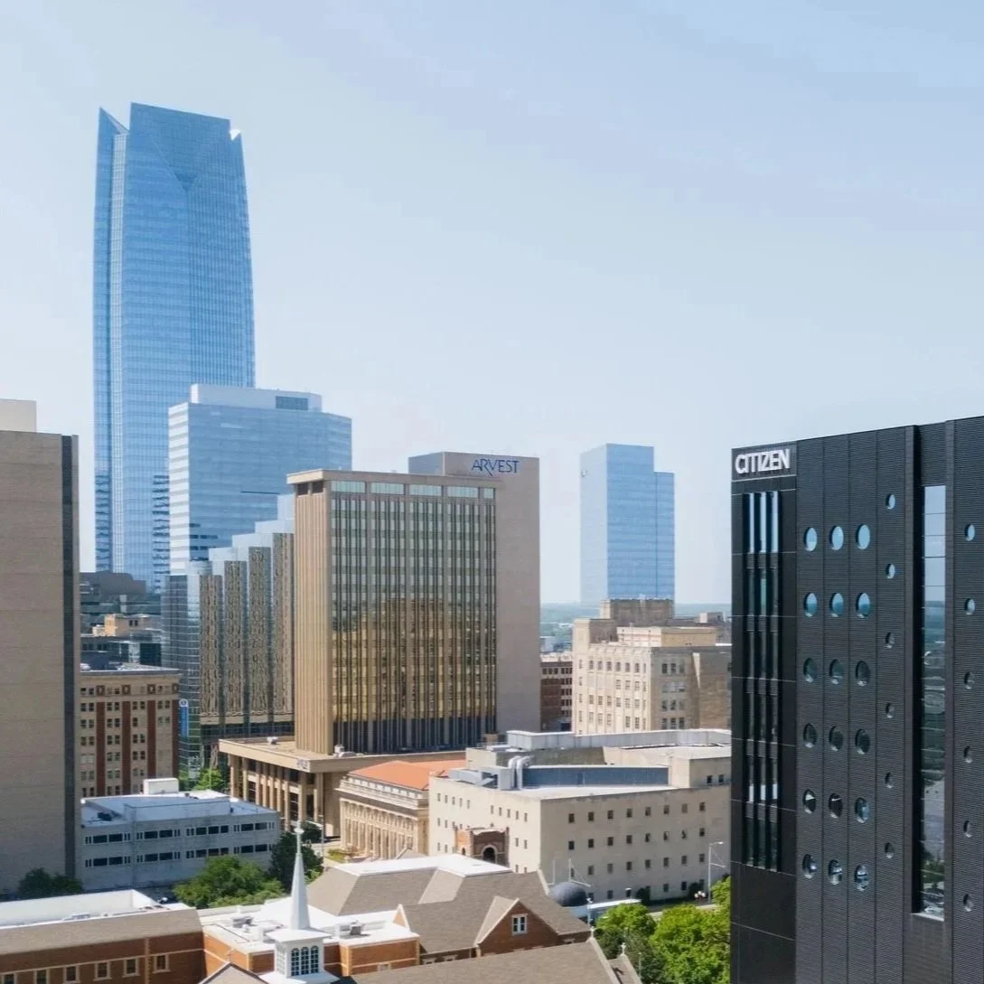 A photo of the Citizen building with Oklahoma City's skyline in the background.