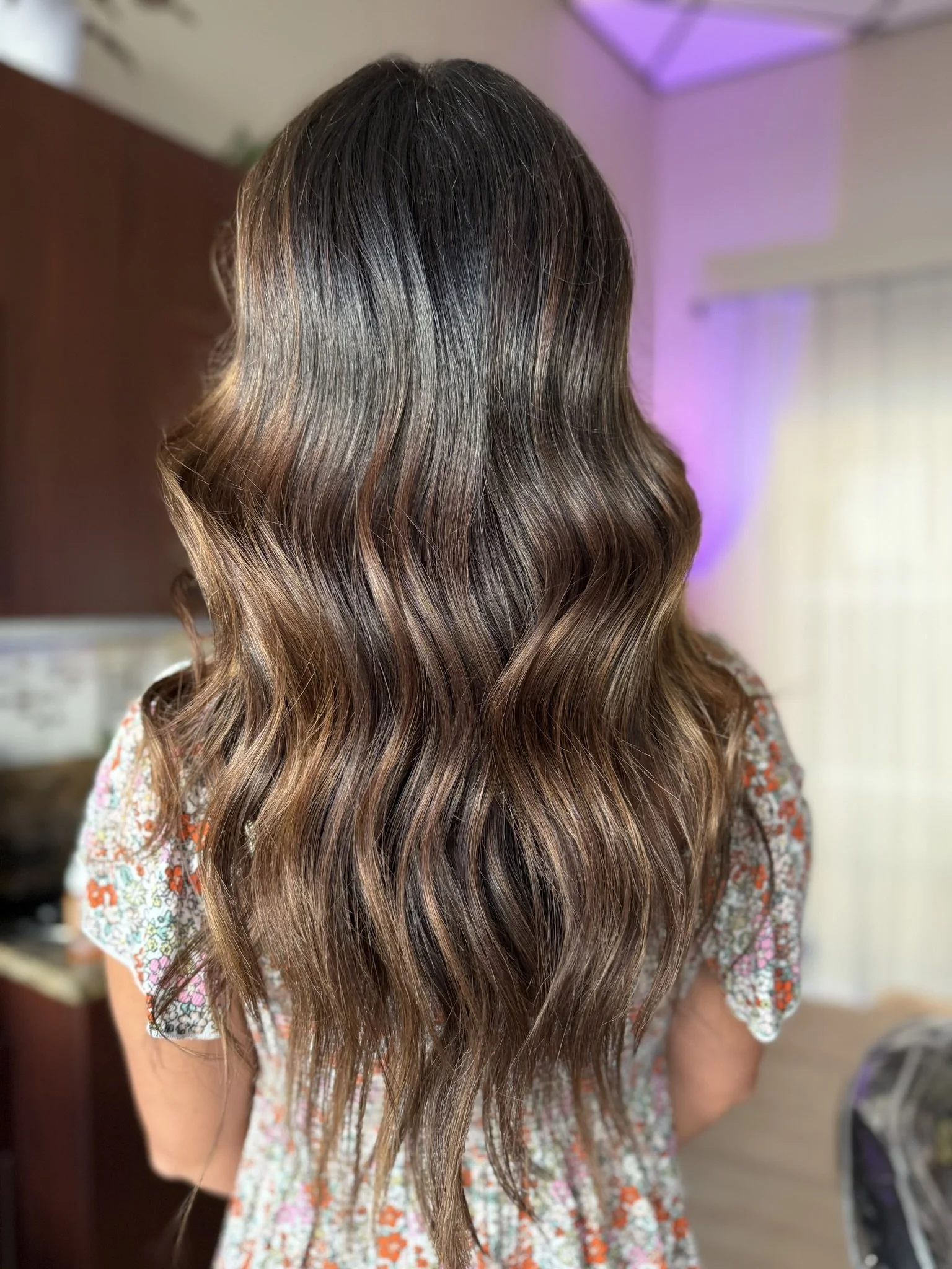 Luxury brunette hair color featuring deep espresso brown tones, subtle mocha dimension, and soft waves by brunette specialist Leah Taylor Salon in St. Petersburg, Florida.
