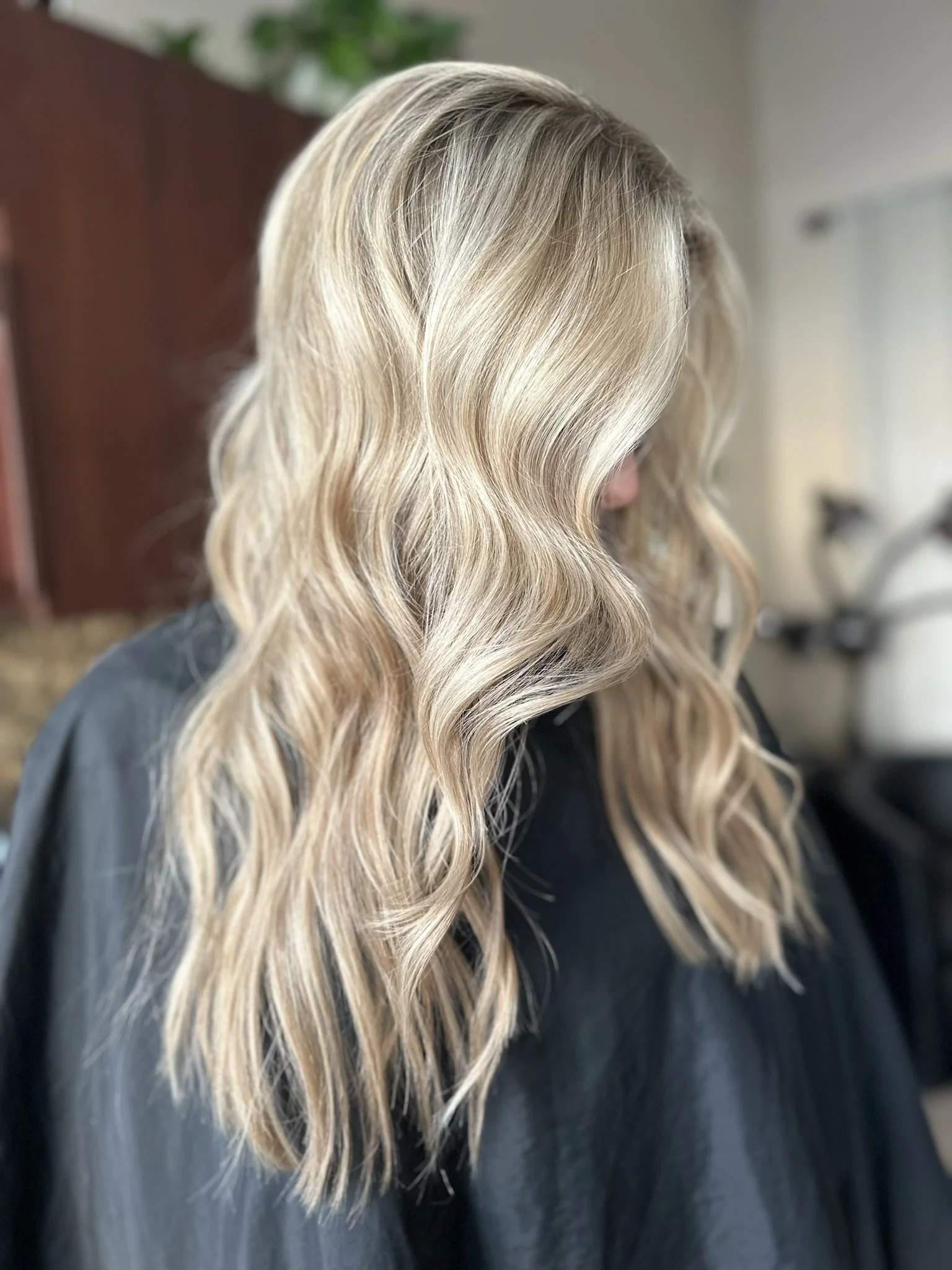 Lived-in blonde balayage with a soft root melt, dimensional beige blonde ribbons, and low-maintenance grow-out created by Leah Taylor Salon in St. Petersburg, Florida.