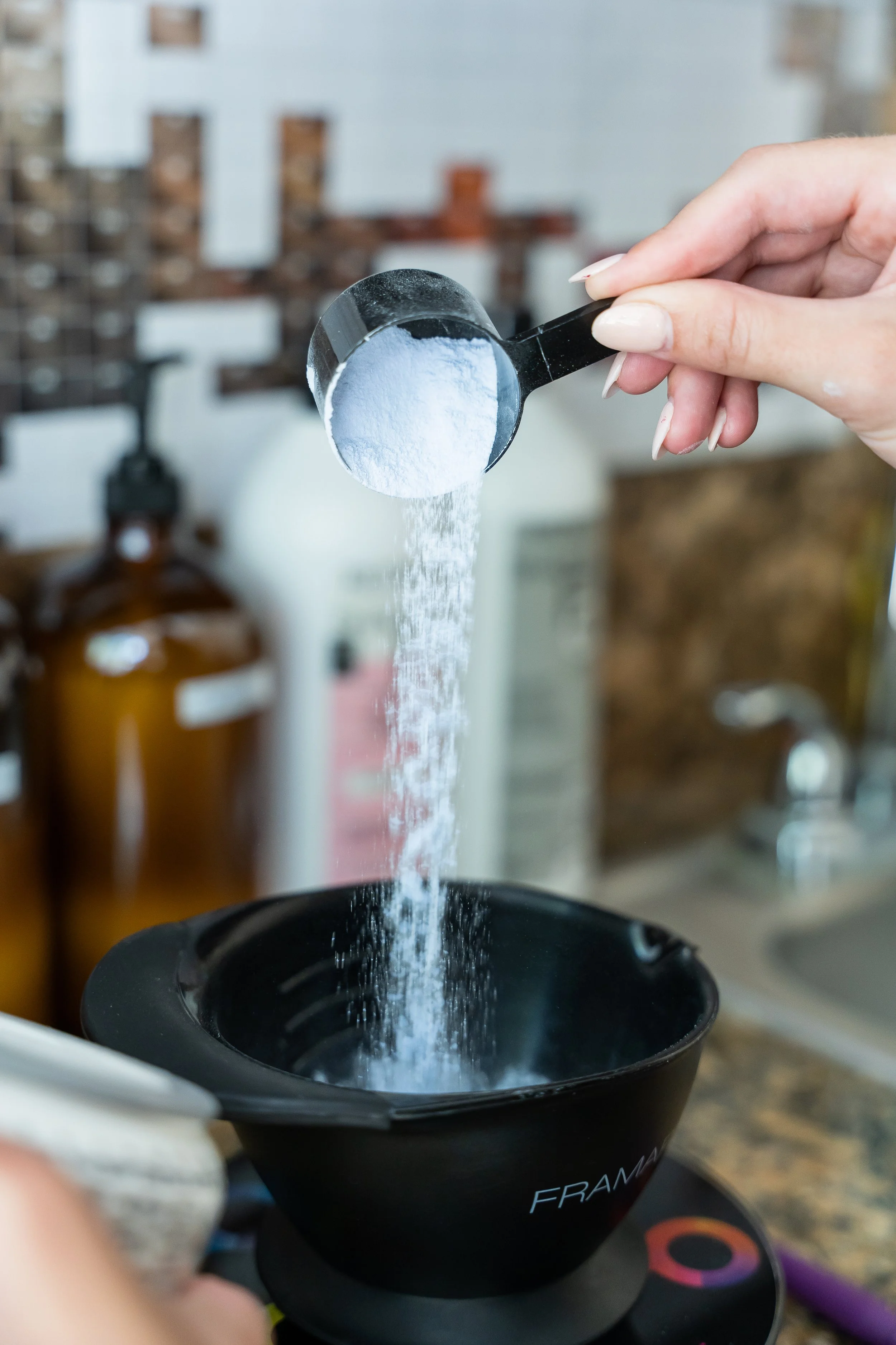 Professional hair color formulation being prepared for dimensional blonding, balayage, and customized hair color services at Leah Taylor Salon.