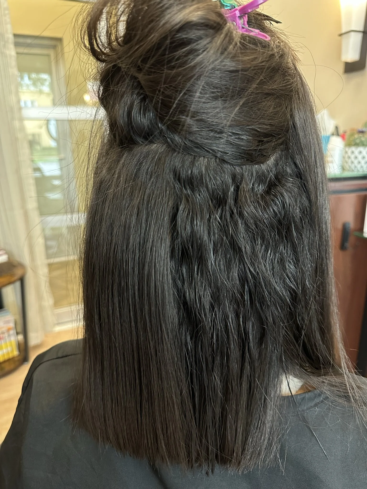 Before and after smoothing treatment featuring Brazilian Blowout and keratin treatment results with reduced frizz, improved shine, and more manageable hair by Leah Taylor Salon in St. Petersburg, Florida.