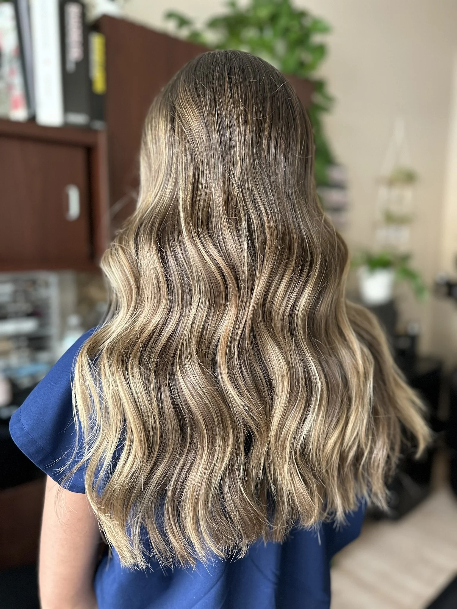 Bronde hair color with seamless balayage, bright face-framing highlights, and a low-maintenance grow-out by Leah Taylor Salon in St. Petersburg, Florida.