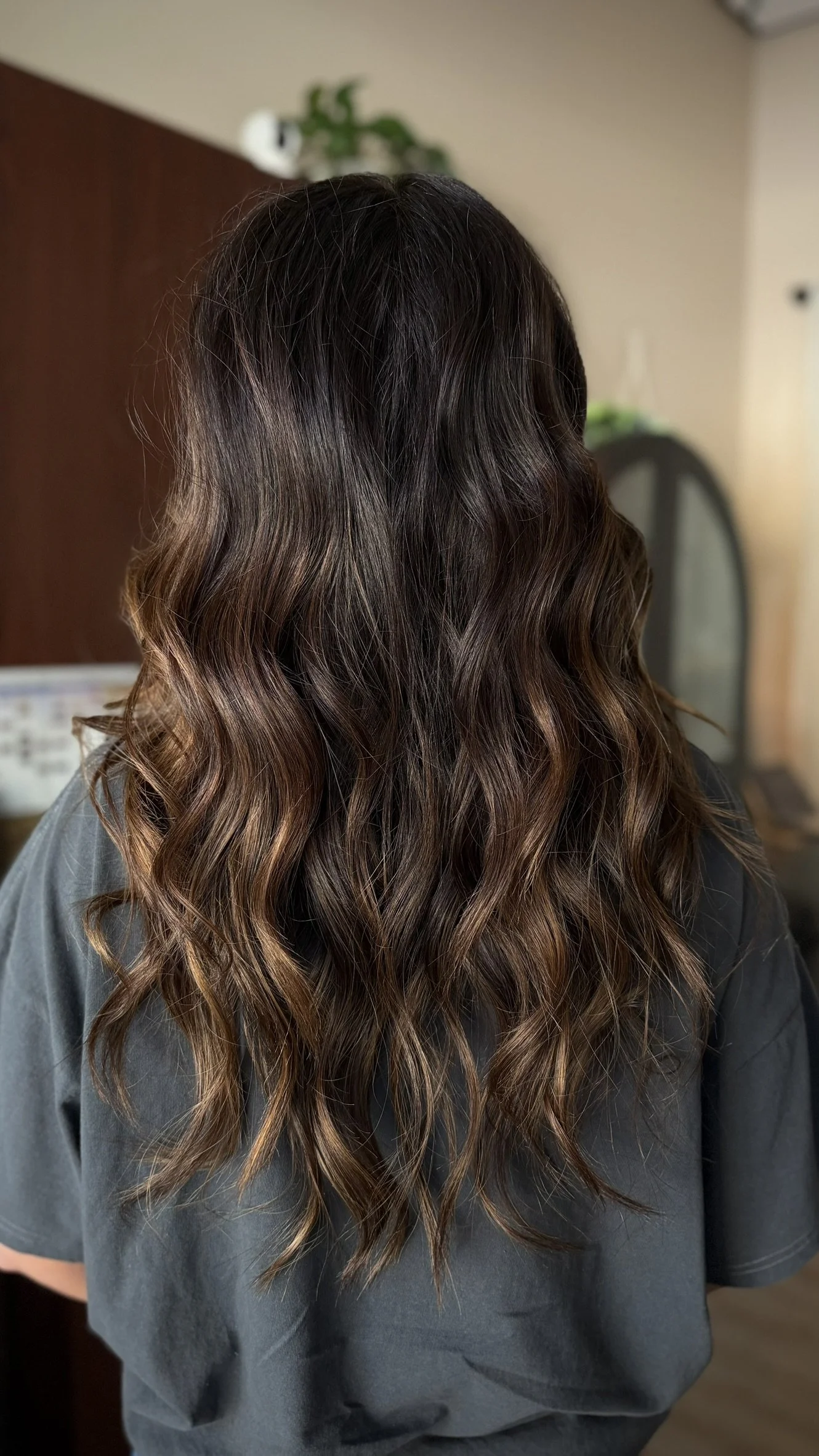 Dimensional brunette hair with espresso depth, mocha brown dimension, and soft lived-in movement by Leah Taylor Salon, brunette specialist in St. Petersburg, Florida.