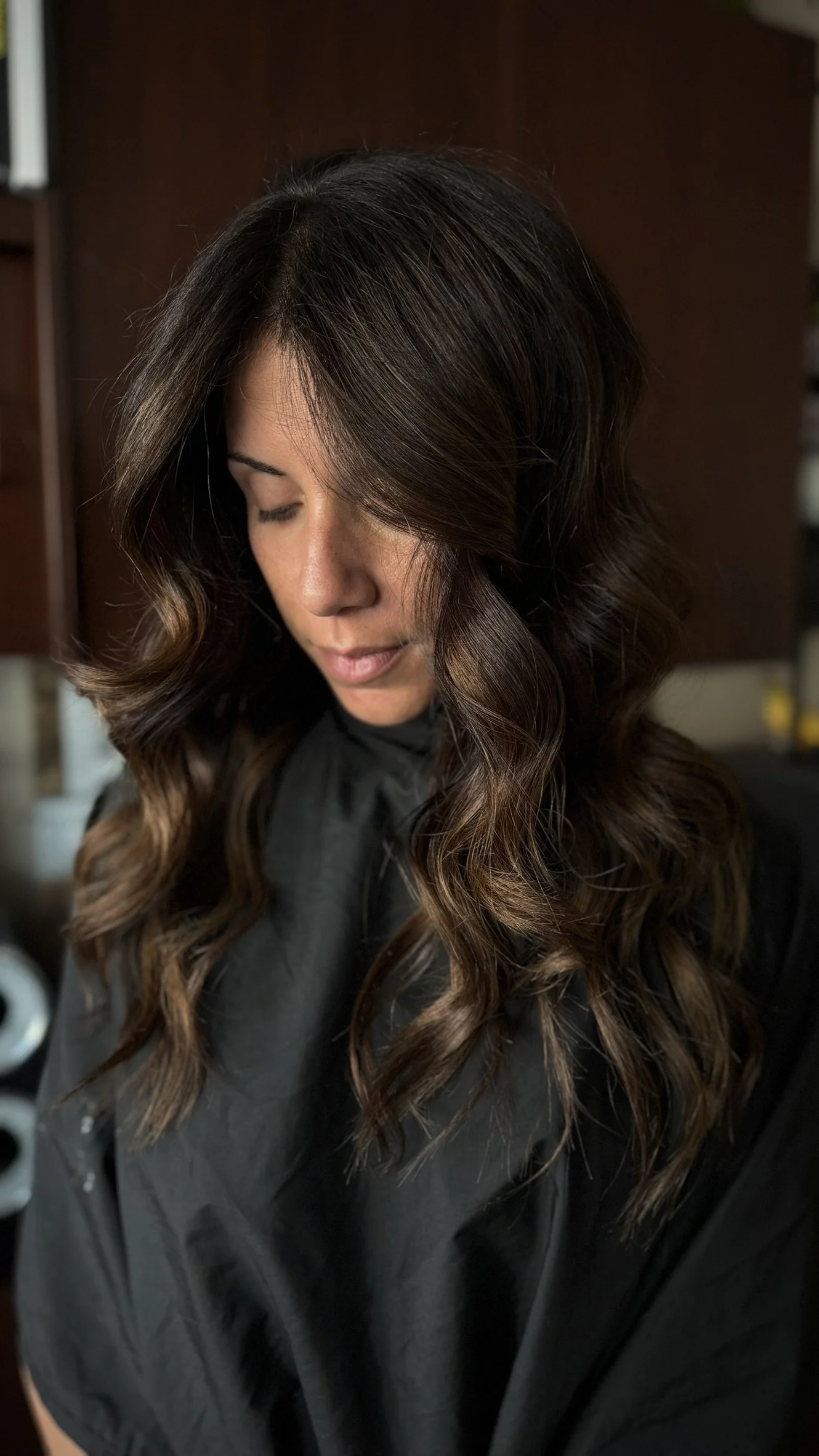 Dimensional brunette hair featuring rich chocolate tones and soft caramel balayage created by Leah Taylor Salon in St. Petersburg, Florida.