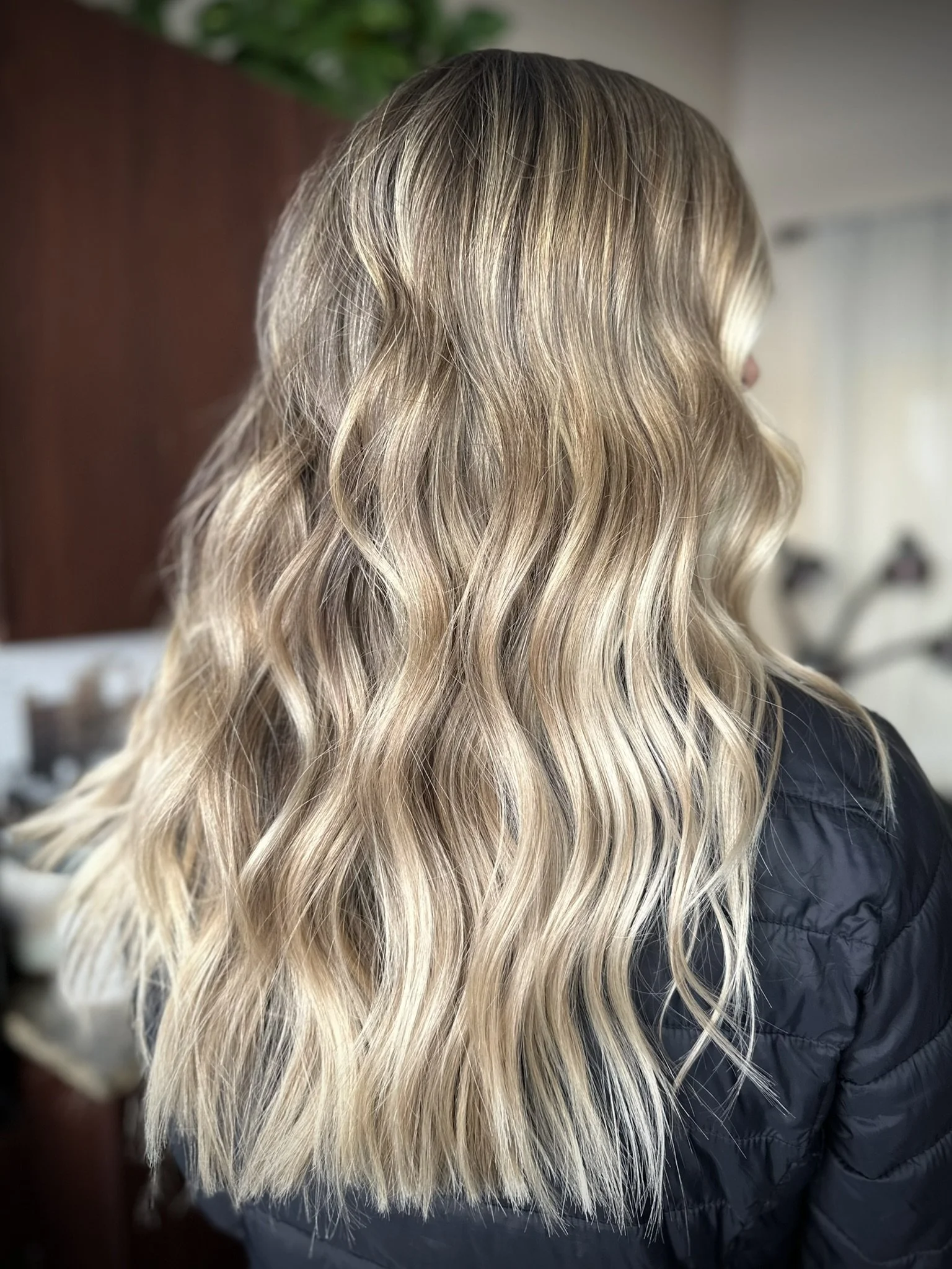 Lived-in blonde balayage with dimensional beige blonde highlights, a root melt, and soft natural depth created by Leah Taylor Salon in St. Petersburg, Florida.