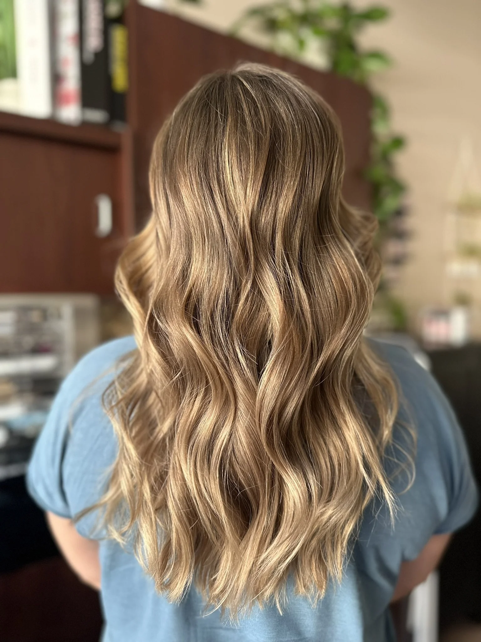 Low-maintenance bronde hair color with dimensional highlights and natural root melt created by Leah Taylor Salon in St. Petersburg, Florida.