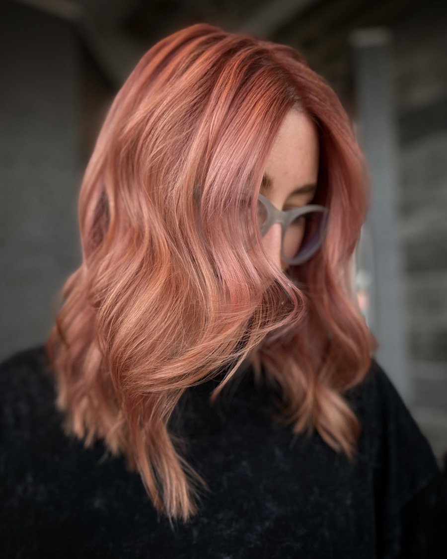 Dimensional rose gold hair with blush copper, soft pink, and pastel copper tones created by Leah Taylor Salon, a color specialist in St. Petersburg, Florida.