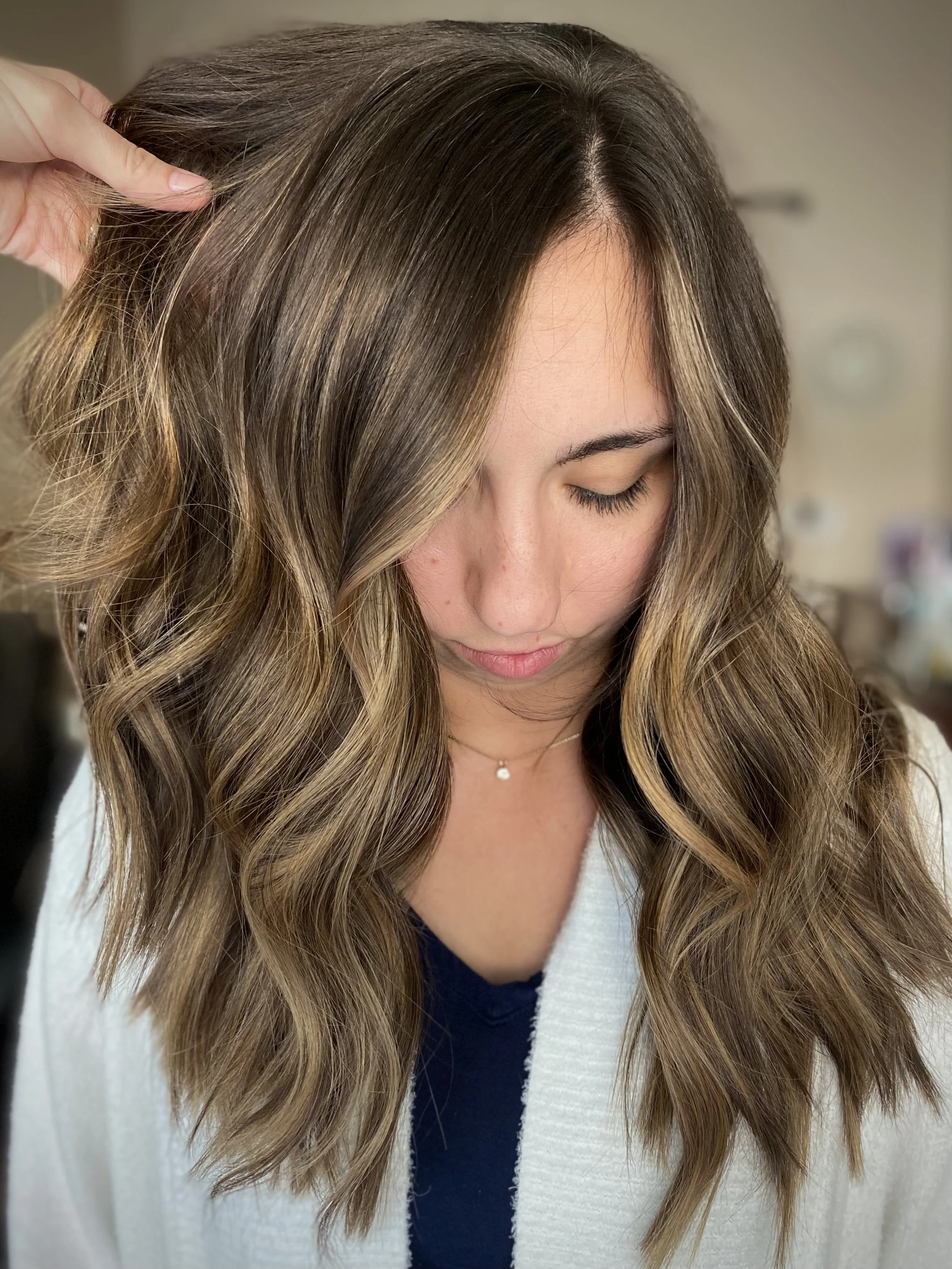 Honey bronde balayage with warm blonde highlights, dimensional brunette tones, and glossy shine by Leah Taylor Salon in St. Petersburg, Florida.