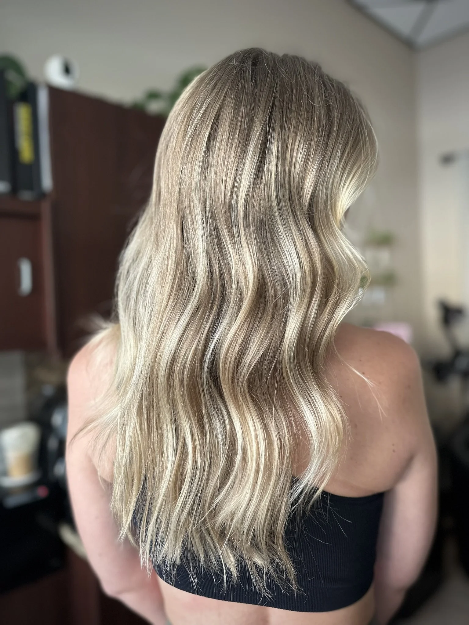 Lived-in blonde balayage featuring beige blonde and champagne blonde tones with a seamless shadow root and dimensional color by Leah Taylor Salon in St. Petersburg, Florida.